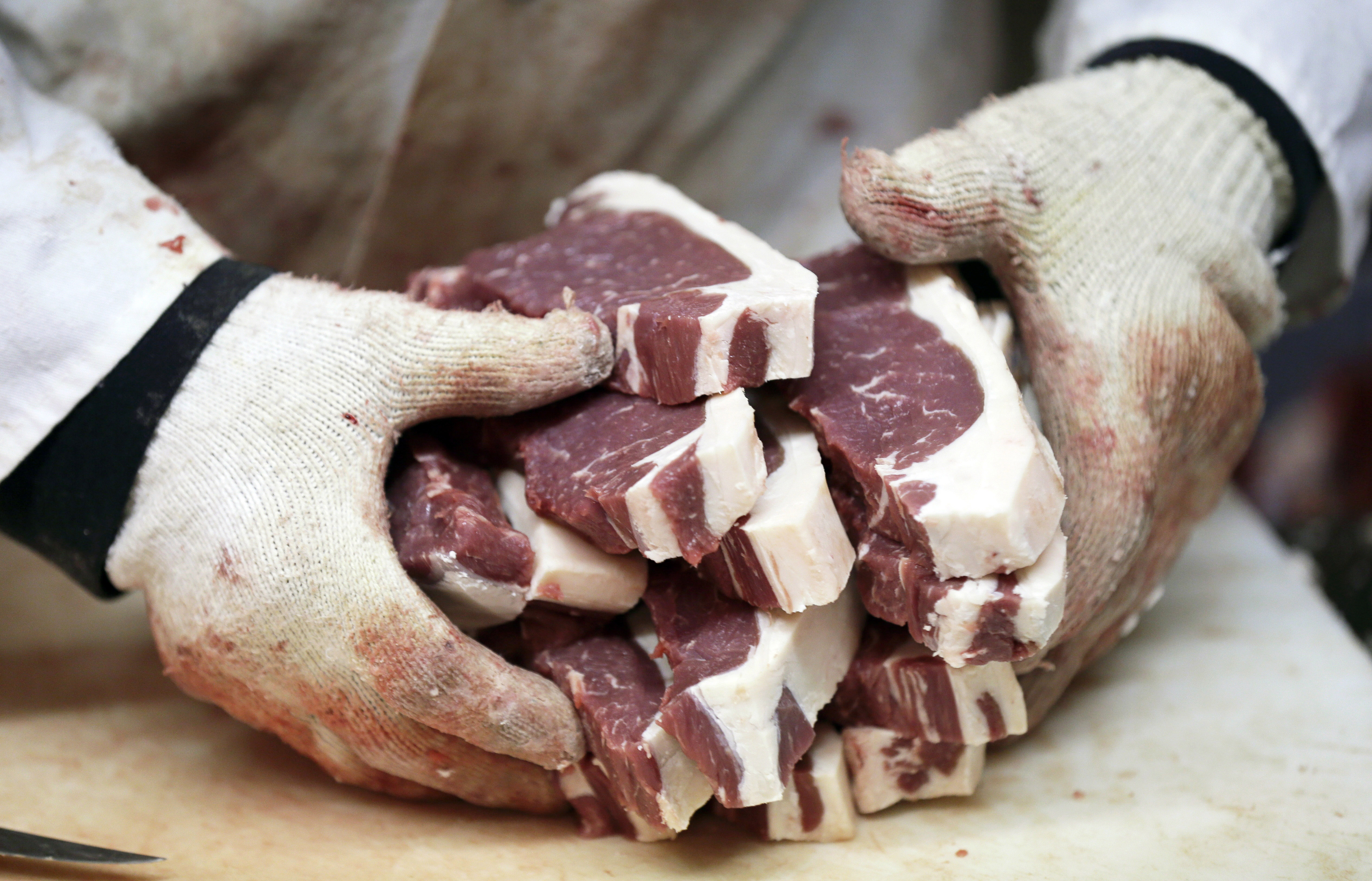 Amend Packing Company owner Kent Weise holds freshly cut New York strip steaks, Tuesday, Feb. 17, 2015, in Des Moines, Iowa. (AP Photo/Charlie Neibergall) (AP)