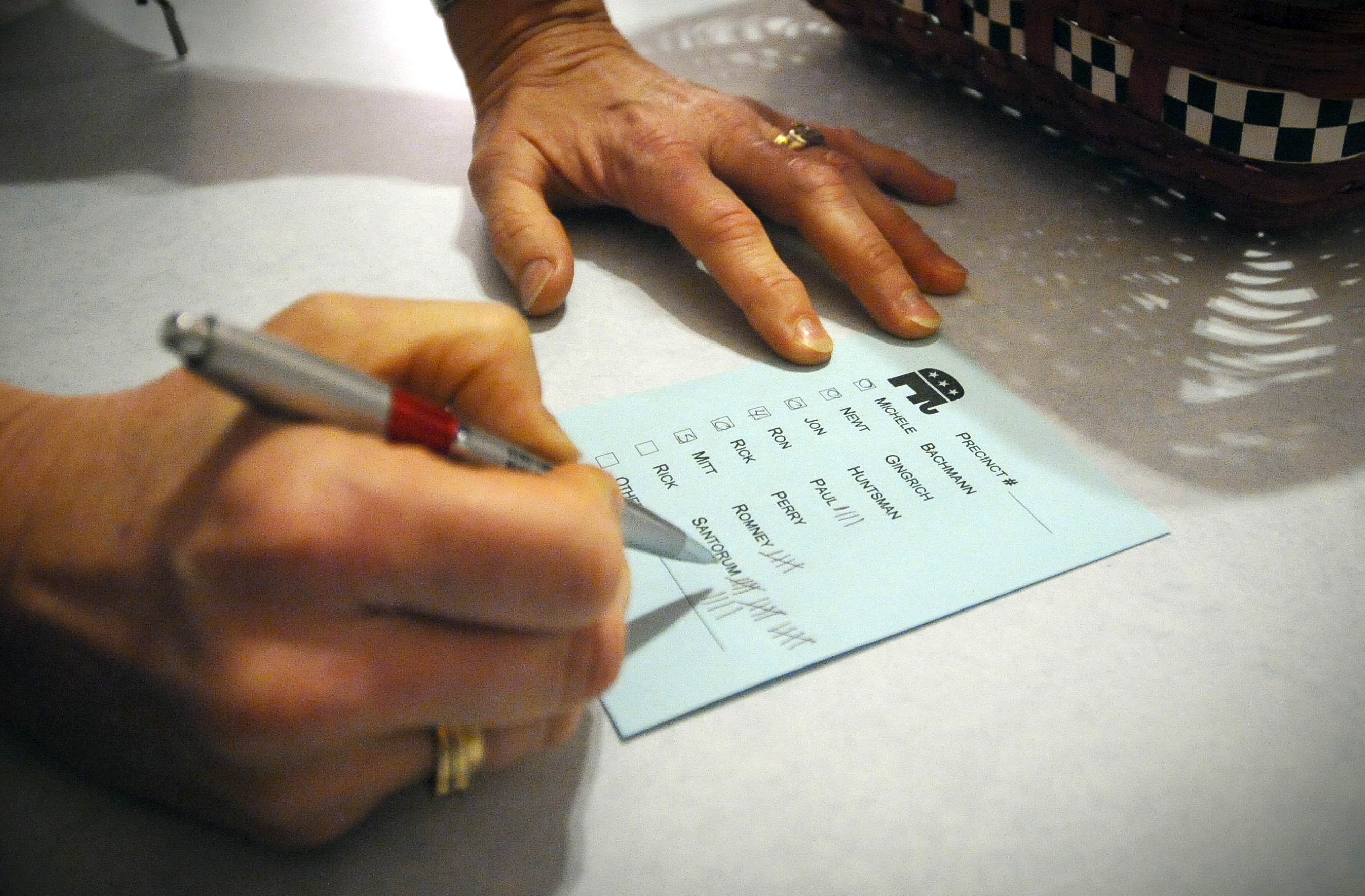 FILE - In this Jan. 3, 2012 file photo, votes are tallied during a caucus of precinct 42 near Smithland, Iowa.  (AP Photo/Dave Weaver, File) (AP)