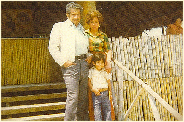 A childhood photo of the author with his parents
