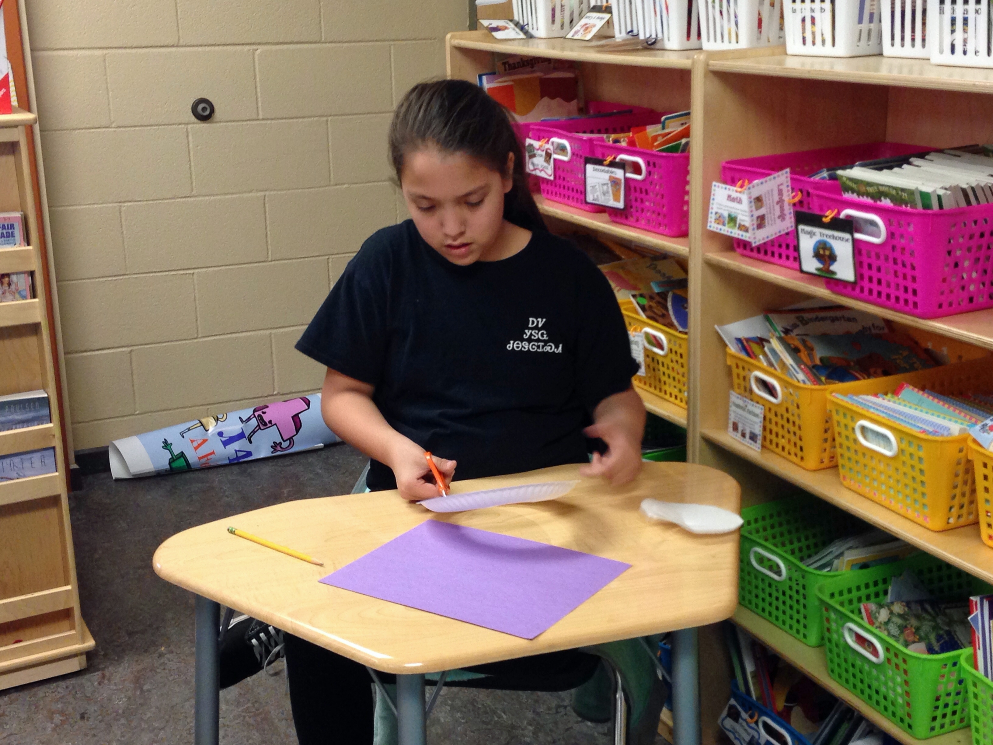 In this Wednesday, Feb. 11, 2015 photo, Cherokee tribe member Haley Smith, 11, works on an English assignment at New Kituwah Academy in Cherokee, N.C. On this particular day, Haley and her classmates were learning about idioms related to Valentines Day. With fewer than 300 native Cherokee speakers remaining in North Carolina, tribe members hope to preserve their language and culture through the small school where their children are immersed in their peoples native tongue. (AP Photo/Martha Waggoner) (AP)