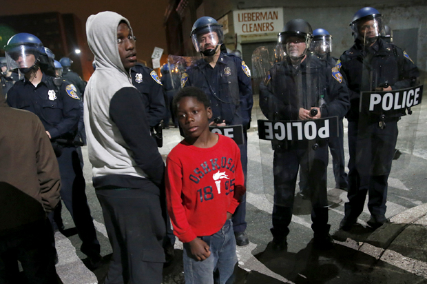 Police stand guard as protesters gather for a rally, Maryland April 25, 2015. (Reuters/Shannon Stapleton)