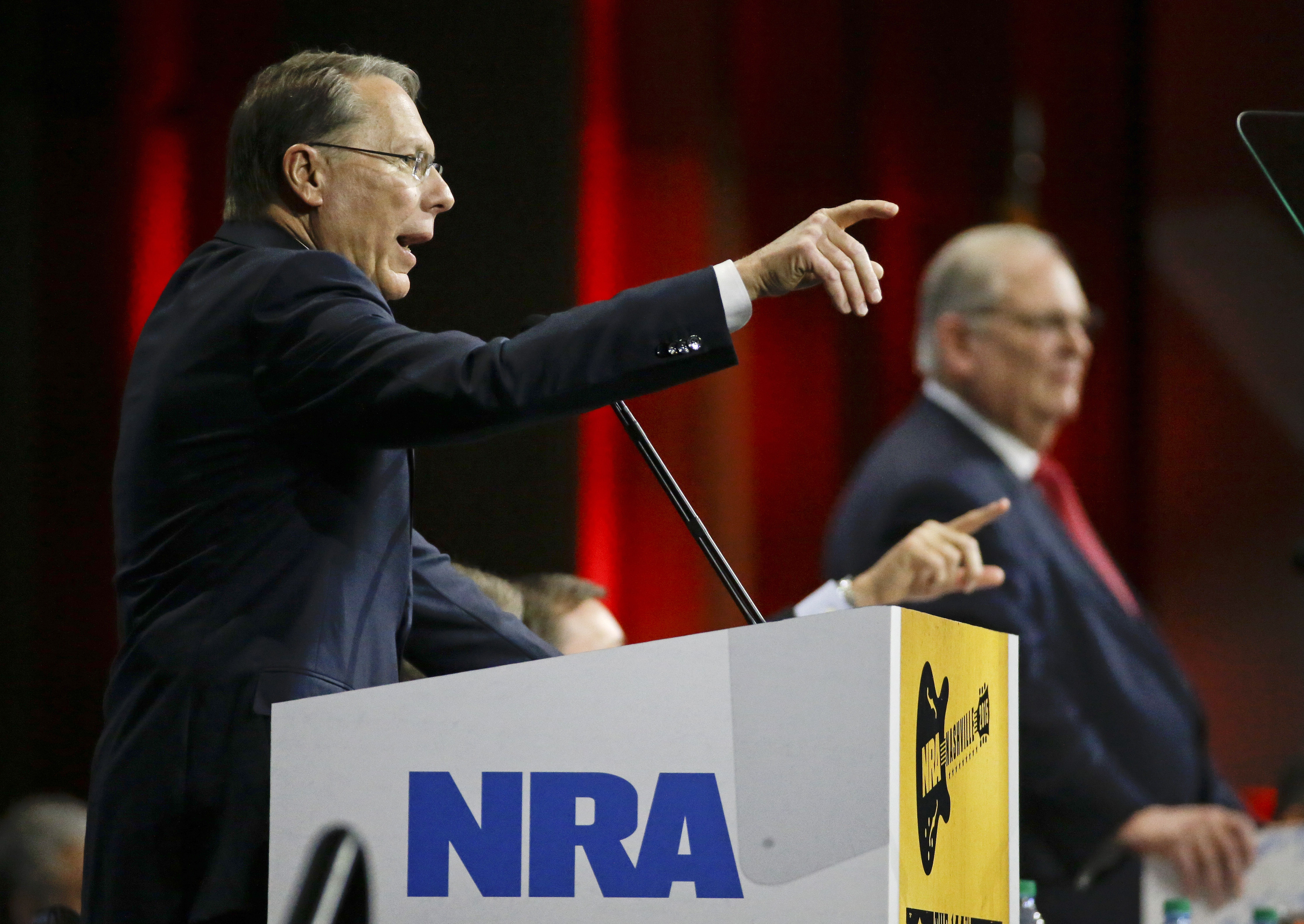 Wayne LaPierre, left, executive vice president of the National Rifle Association, speaks during the annual meeting of members at the NRA convention Saturday, April 11, 2015, in Nashville, Tenn. At right is Jim Porter, NRA president. (AP Photo/Mark Humphrey) (AP)