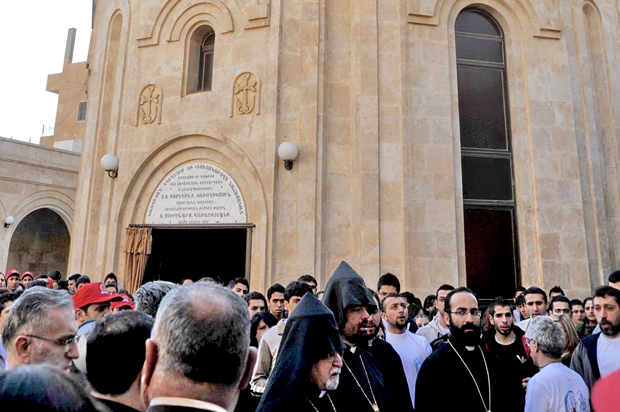 People gather at the Holy Martyrs Armenian Church in Deir Zor, Syria, in 2009, five years before it was destroyed in a bombing. (flickr/Studio Ashnag)