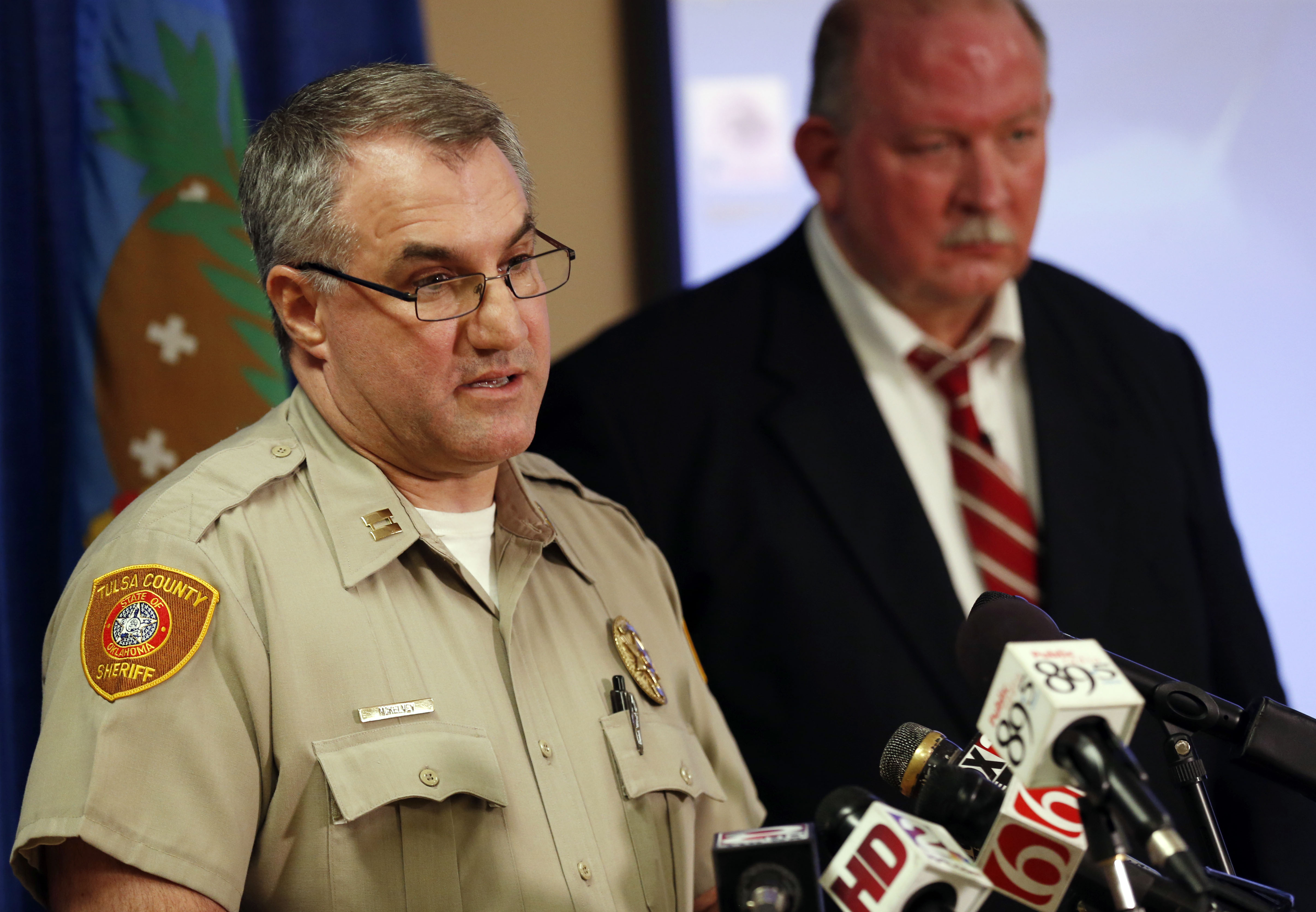 In this Friday, April 10, 2015, photo, Tulsa County Sheriff's Office Capt. Billy McKelvey, left, speaks next to Jim Clark, an independent consultant, during a news conference about the investigation of the death of Eric Harris in Tulsa, Okla. Police say a reserve sheriff's deputy thought he was holding a stun gun, not his handgun, when he fatally shot Harris during an arrest that was caught on video in Tulsa. (Cory Young/Tulsa World via AP) (AP)