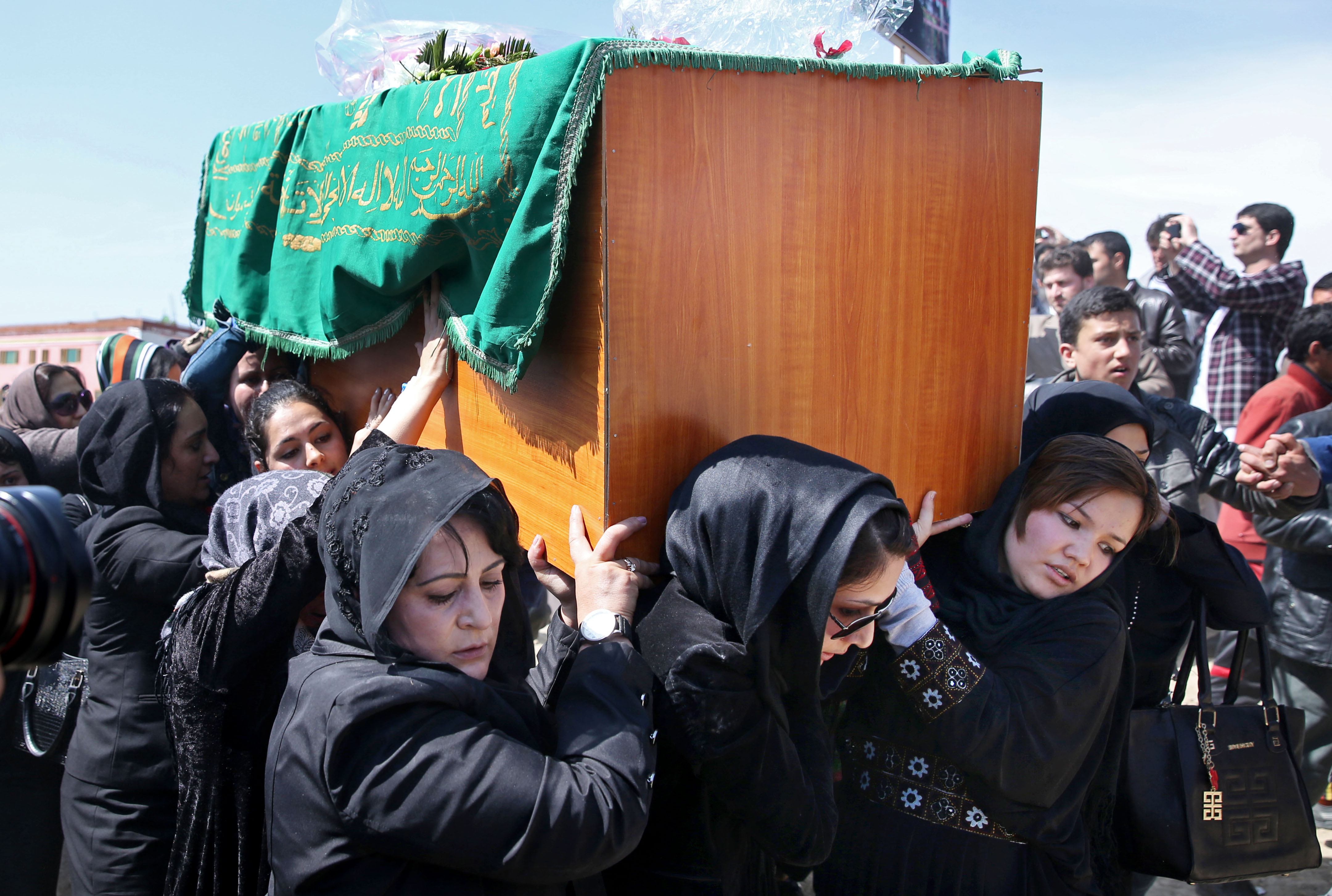 Afghan women rights activists carry the coffin of 27-year-old Farkhunda, an Afghan woman who was beaten to death by a mob. (AP/Massoud Hossaini)