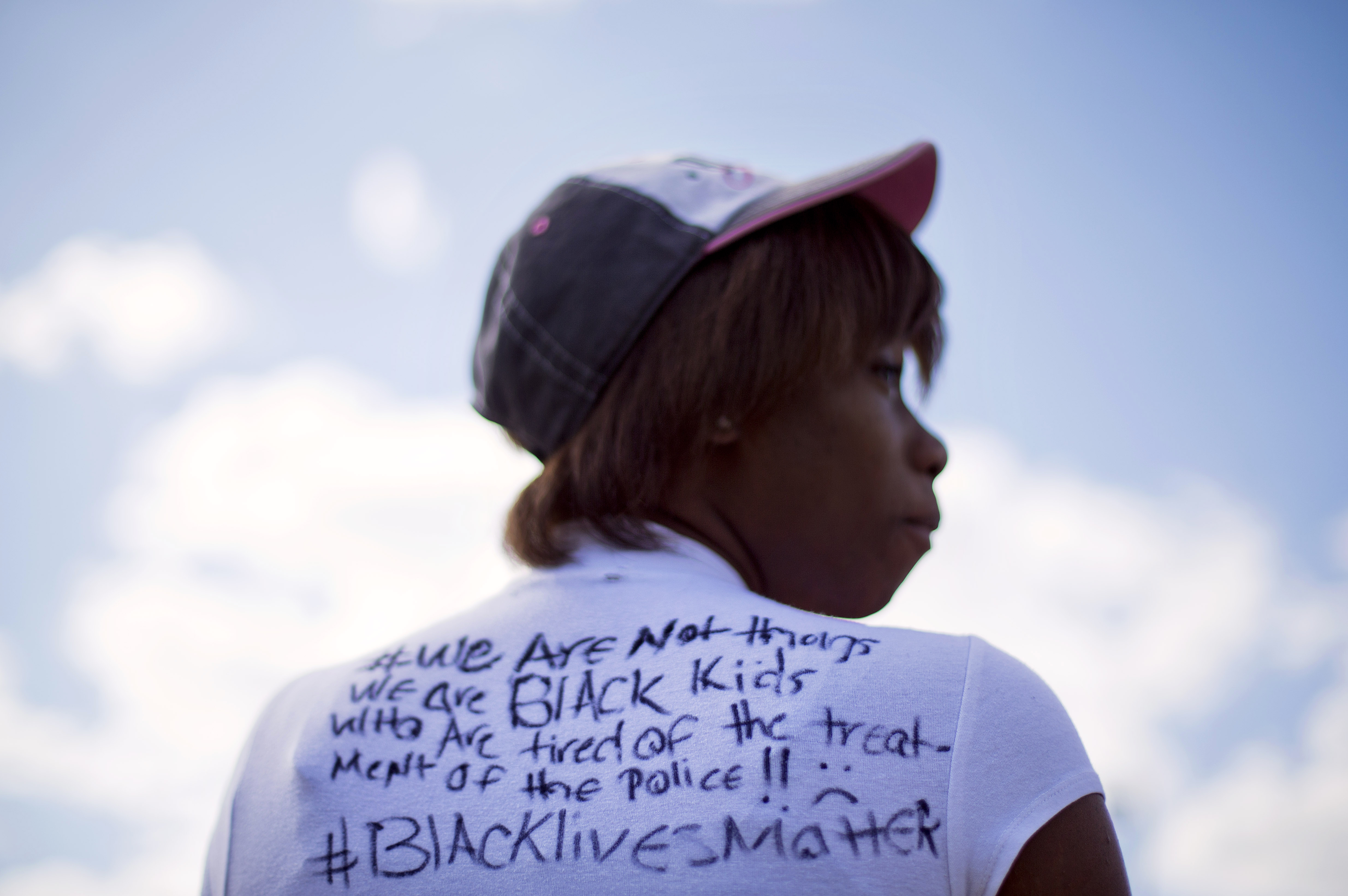 Alize LeGrange, 18, wears a T-shirt she made in response to Baltimore Mayor Stephanie Rawlings-Blake's comments about "thugs" trying to tear down the city as she waits for a bus at the Mondawmin Metro Station (AP Photo/David Goldman)