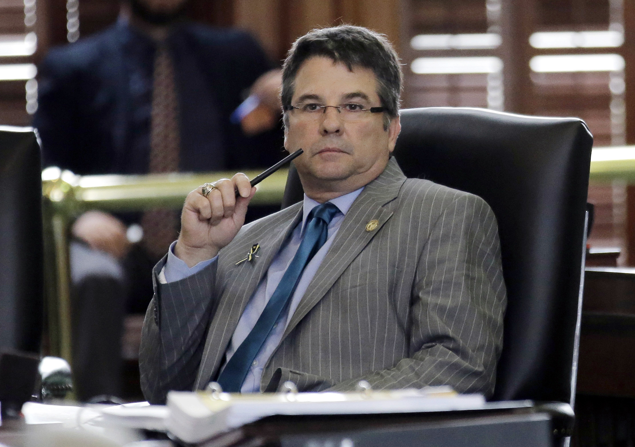 Texas Sen. Charles Perry, R- Lubbock, sits in the Senate Chambers at the Texas State Capitol, Tuesday, May 12, 2015, in Austin, Texas.  A woman in Oklahoma has requested a protective order against Perry, whom she accuses of stalking and threatening to harm her. (AP/Eric Gay)