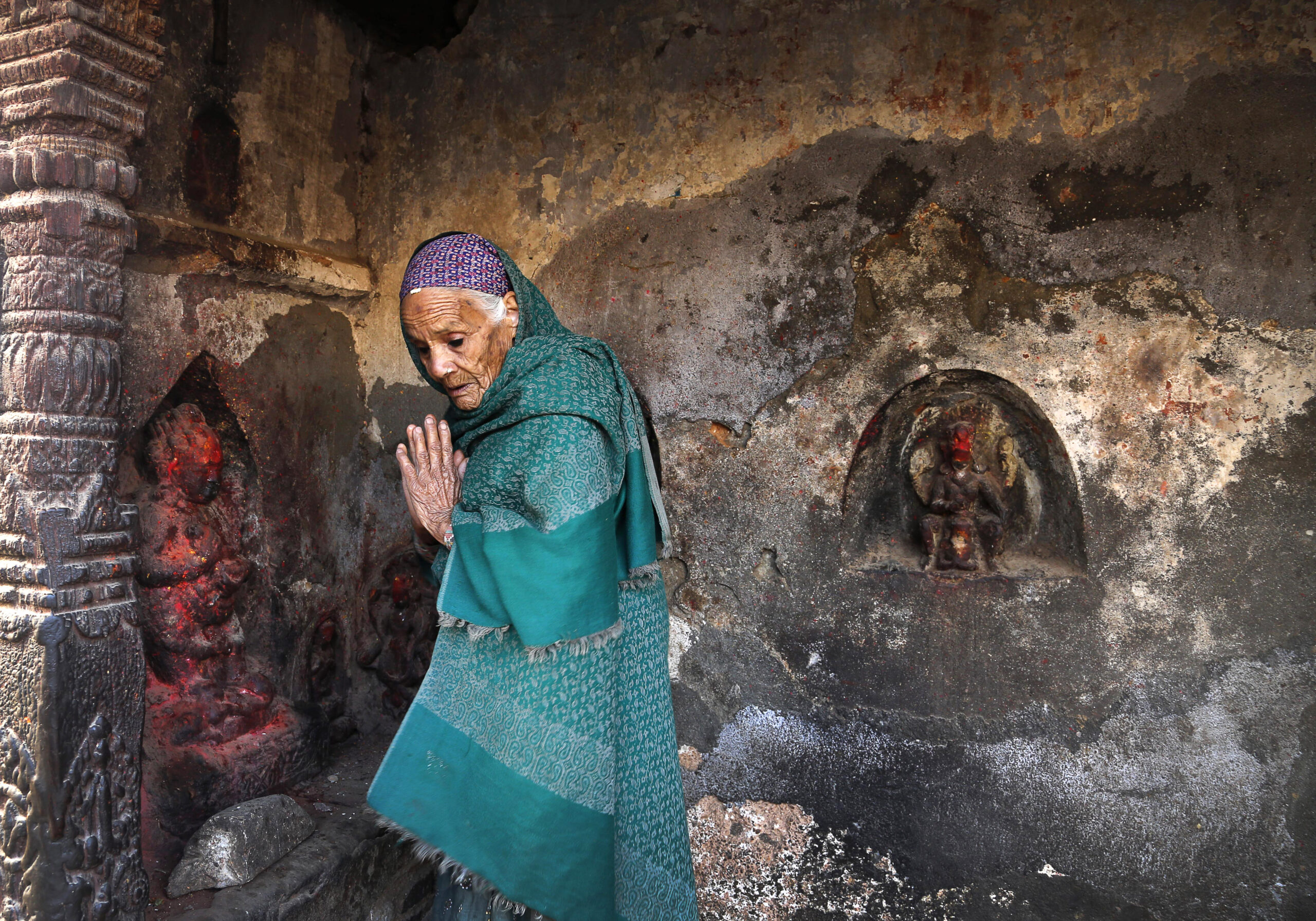 An elderly Nepalese woman prays at a damaged temple in earthquake
, in Kathmandu, Nepal ,Friday, May 1, 2015. (AP Photo / Manish Swarup) (Manish Swarup)
