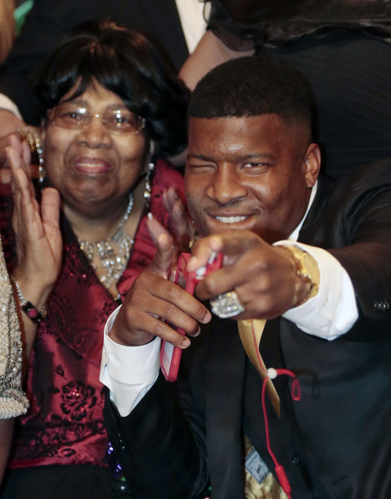 Jameis Winston reacts to the announcement with his Grandmother, Myrtle Winston, watching as the Tampa Bay Buccaneers select him as the number one draft pick in the 2015 NFL Draft, Thursday, April 30, 2015, in Bessemer, Ala. (AP Photo/Butch Dill) (AP)