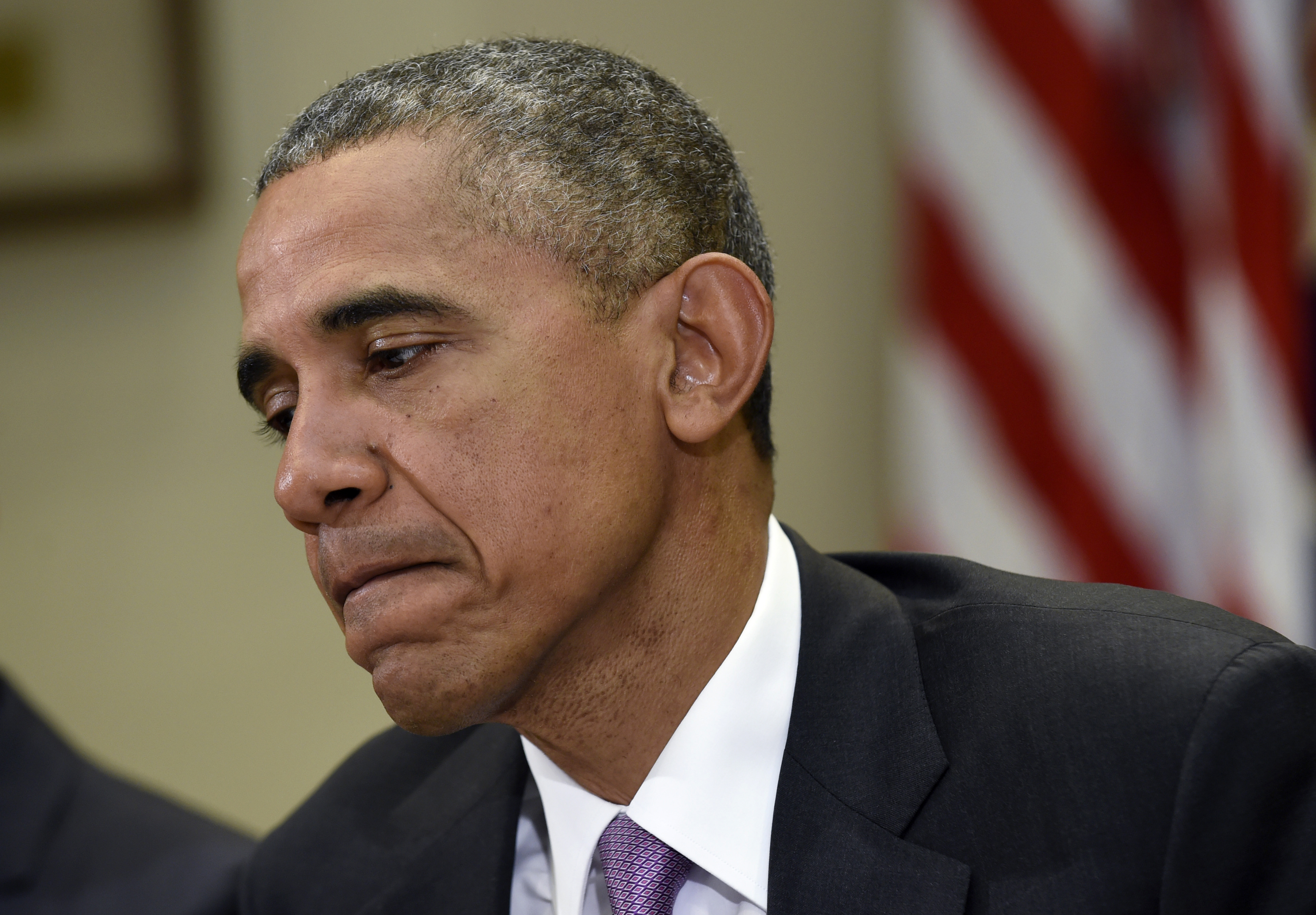 President Barack Obama pauses as answers a question about the situation in Baltimore during a meeting in the Roosevelt Room of the White House in Washington, Friday, May 1, 2015, with persecuted journalists to mark World Press Freedom Day. The president Barack Obama said it's "absolutely vital" that the truth about what happened to Freddie Gray comes out.  (AP Photo/Susan Walsh) (AP)