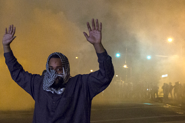 A man attempting to keep peace between protesters and riot police in Baltimore, April 28, 2015. (Reuters/Adrees Latif)