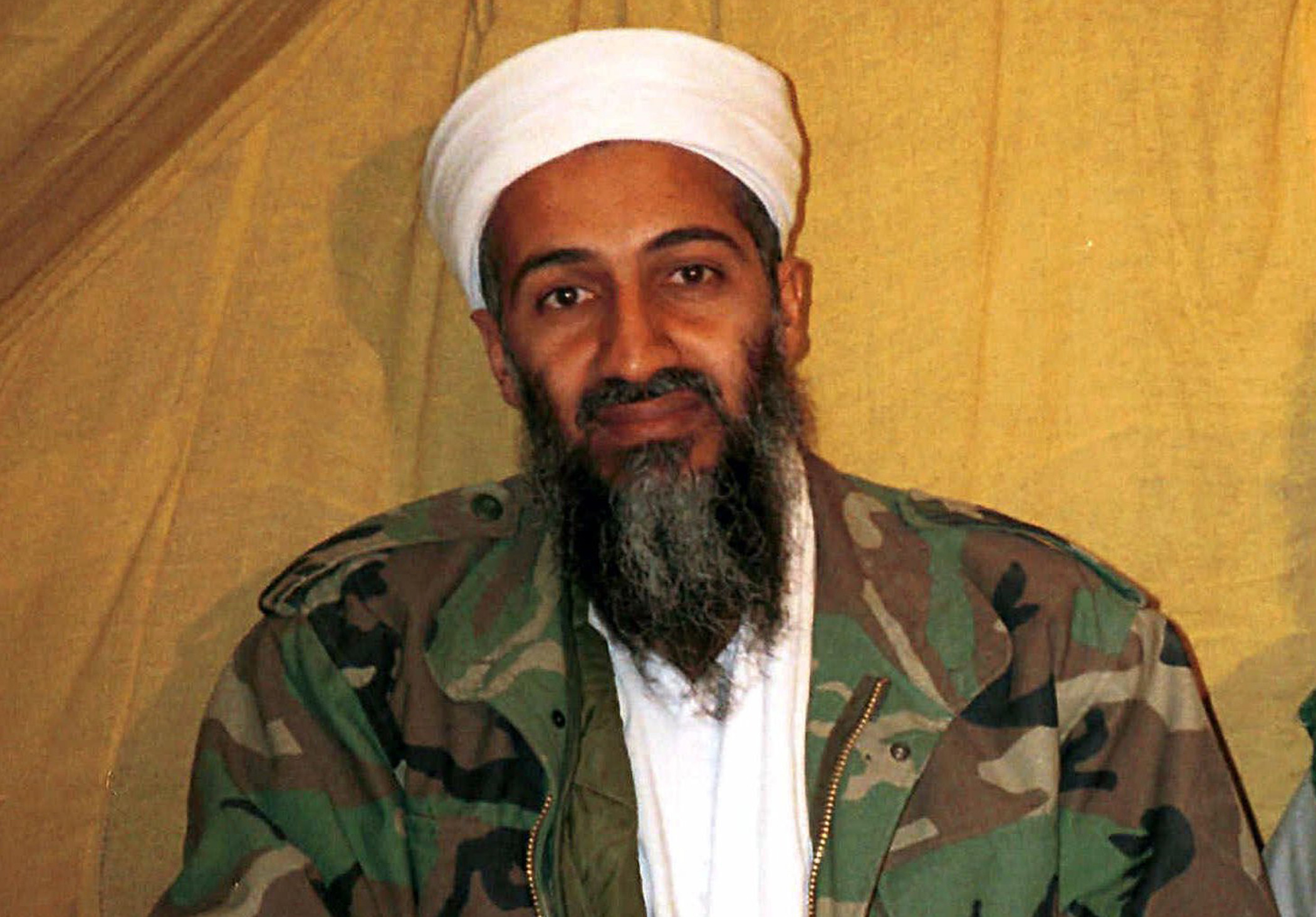FILE - This undated file photo shows al Qaida leader Osama bin Laden in Afghanistan. U.S. intelligence officials have released more than 100 documents seized in the raid on Osama bin Ladens compound, including a loving letter to his wife and a job application for his terrorist network. The Office of the Director of National Intelligence says the papers were taken in the Navy SEALs raid that killed bin Laden in Pakistan in 2011. (AP Photo, File)