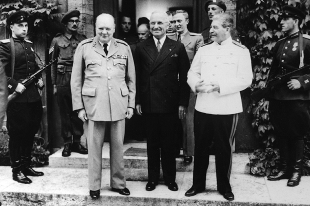 Winston Churchill, Harry S.Truman, and Josef Stalin pose in Potsdam, Germany, July 23, 1945. (AP)