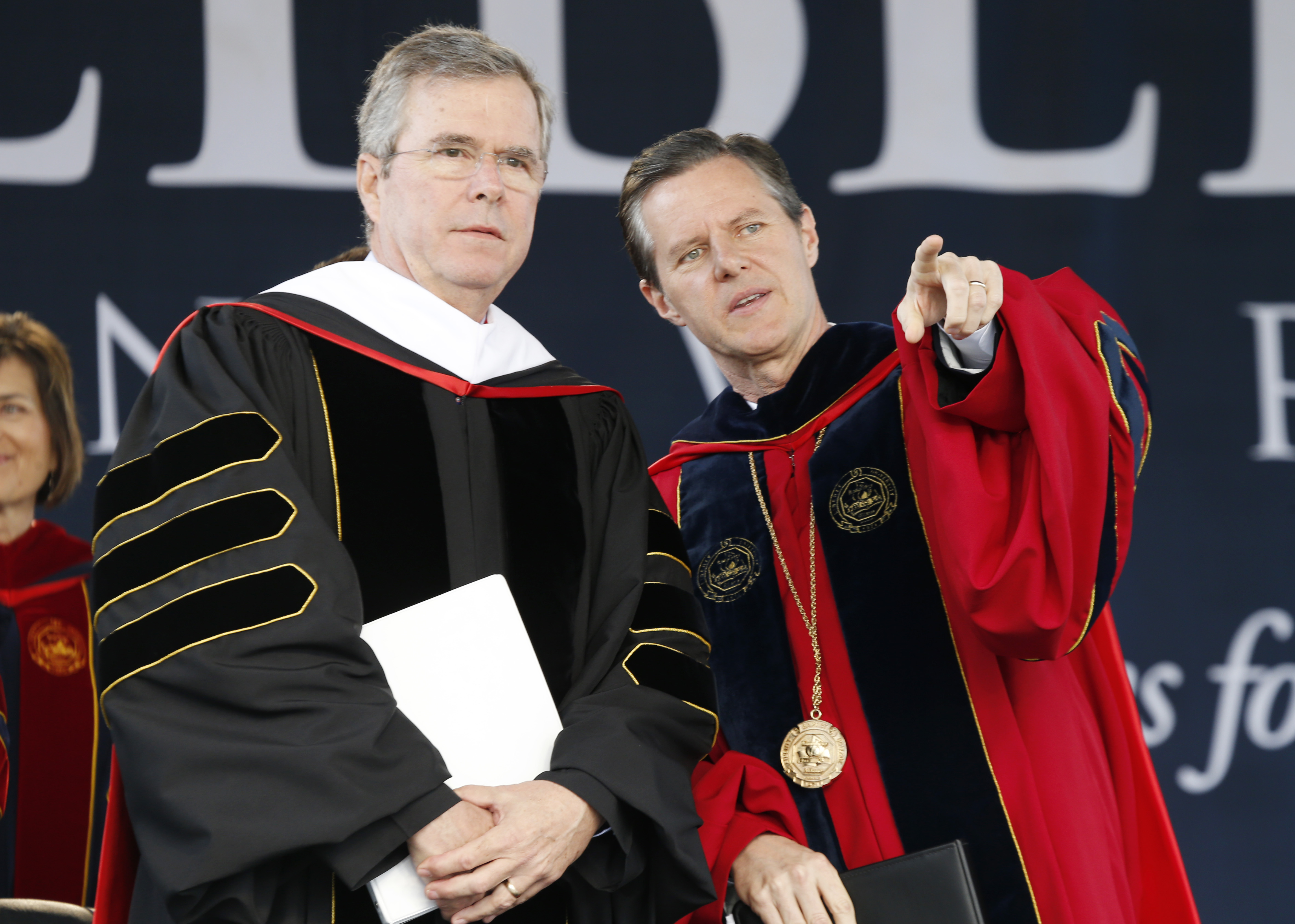 Commencement speaker former Florida Gov. Jeb Bush, left, arrives on stage with Liberty University president, Jerry Falwell Jr., for commencement ceremonies in Williams Stadium at the school in Lynchburg, Va., Saturday, May 9, 2015.   (AP Photo/Steve Helber) (AP)