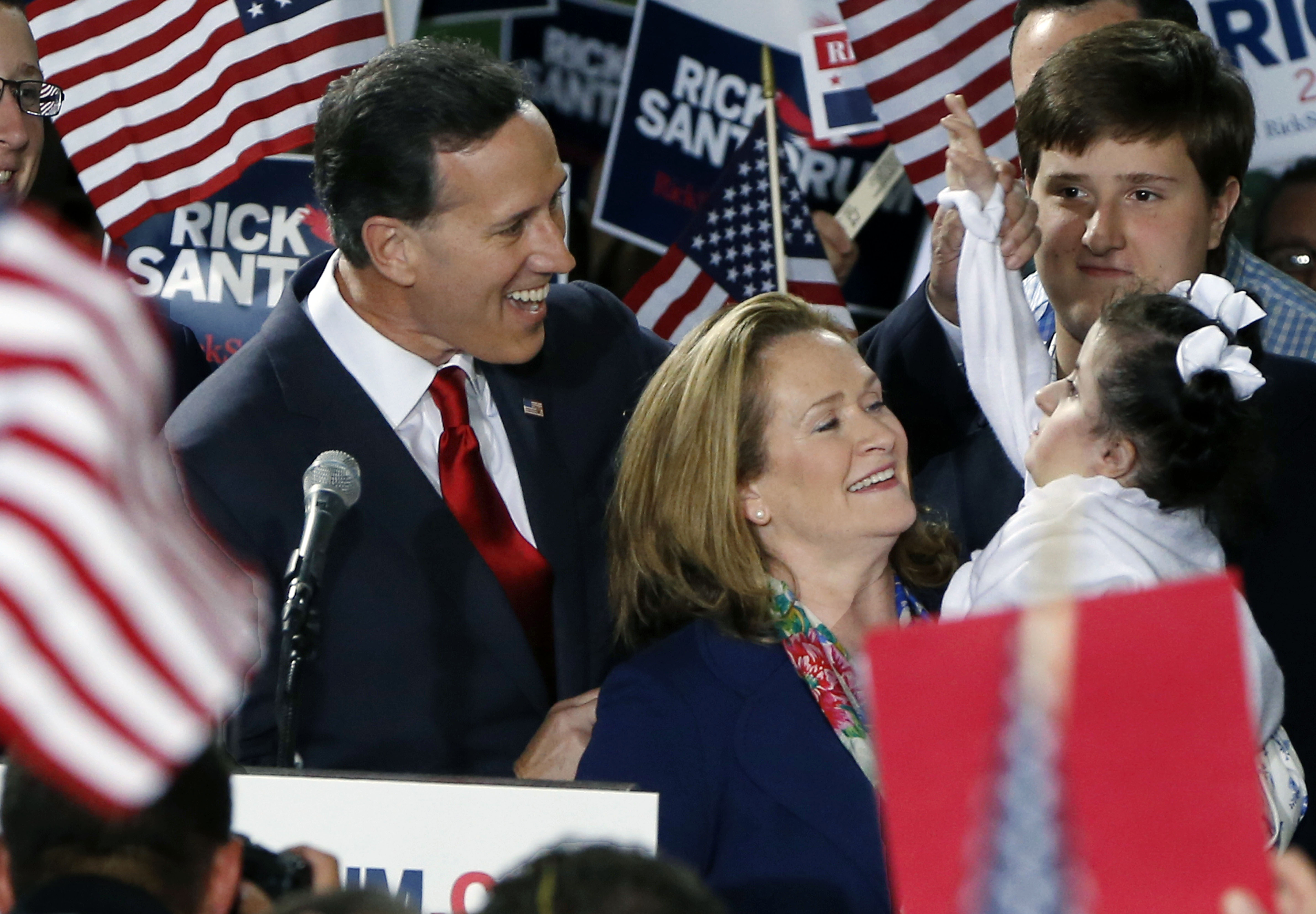 Former U.S. Sen. Rick Santorum, left, and his wife Karen, center, talk with his daughter Bella, right, as he announces his candidacy for the Republican nomination for President of the United States in the 2016 election on Wednesday, May 27, 2015 in Cabot, Pa. (AP Photo/Keith Srakocic) (AP)