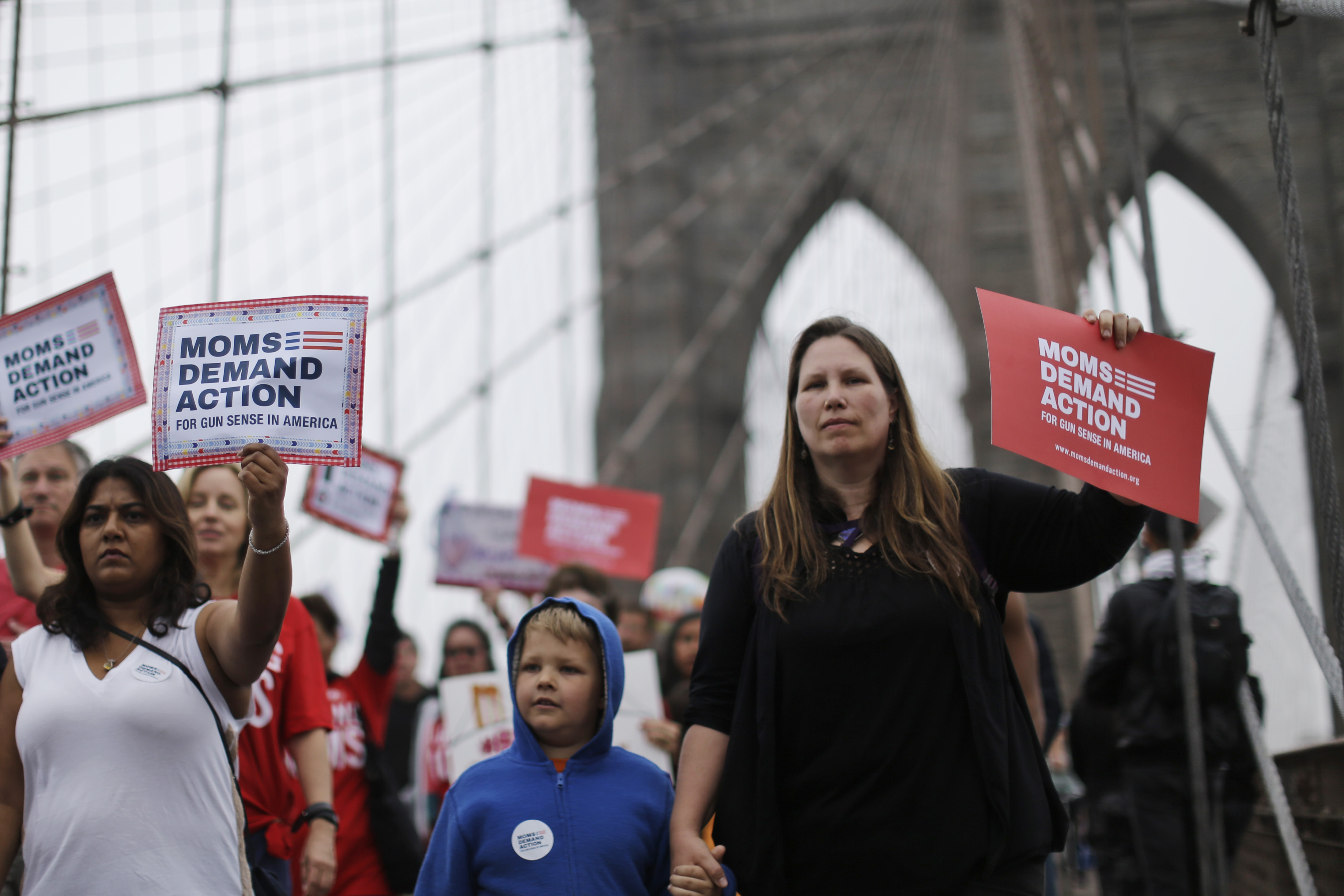 Demonstrators march over the Brooklyn bridge during the third annual Brooklyn bridge march and rally to end gun violence Saturday, May 9, 2015, in New York. Organizers said the proliferation of guns results in an average of more than 80 deaths a day across the country. (AP Photo/Mary Altaffer) (AP)