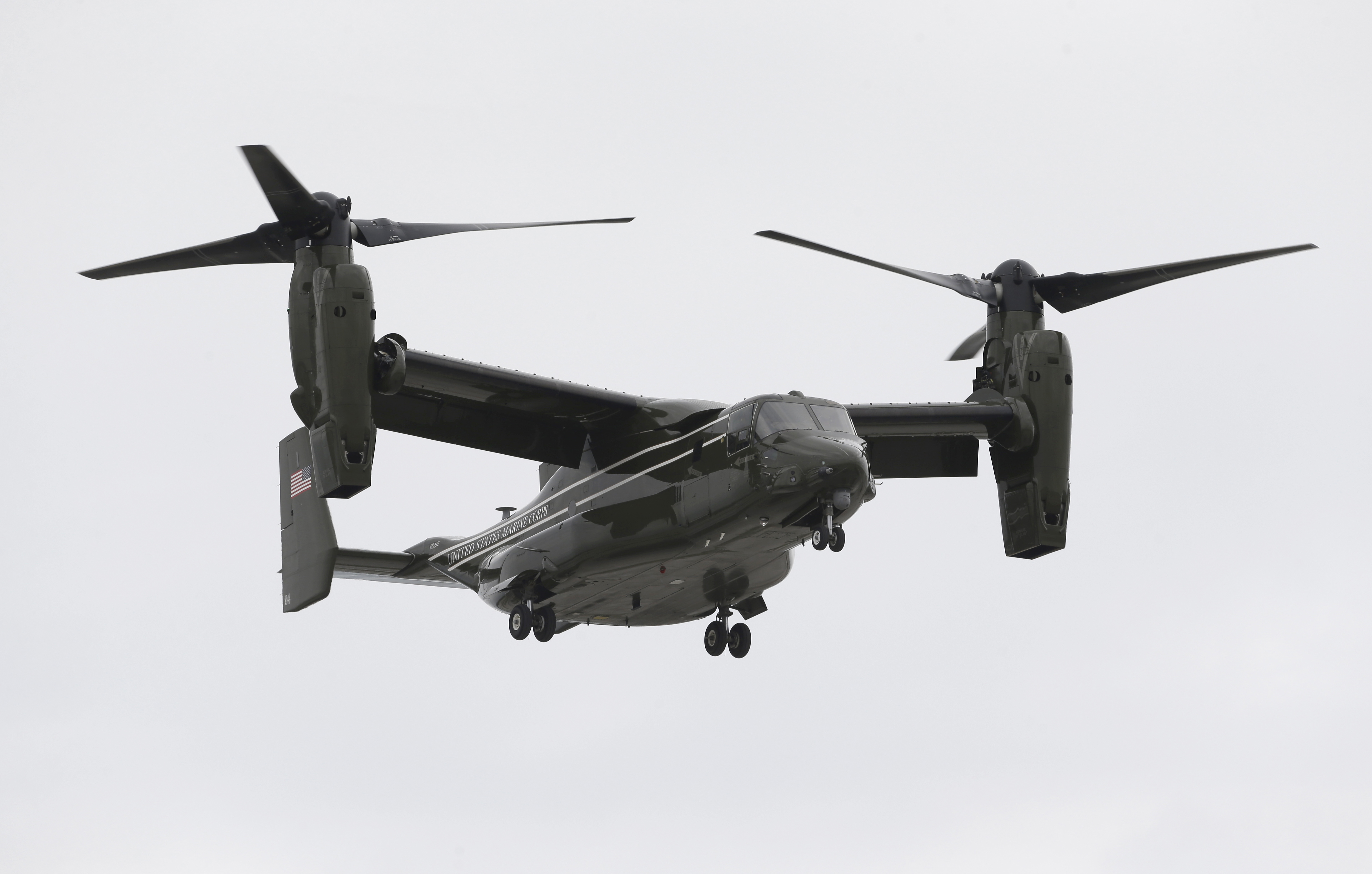 In this April 22, 2015 photo, a Marine Corps MV-22 Osprey comes in for a landing at Miami International Airport before a presidential visit, in Miami. A fatal crash of a U.S. Marine Corps aircraft in Hawaii has renewed safety concerns in Japan, where more of the Ospreys will be deployed. (AP Photo/Wilfredo Lee) (Wilfredo Lee)