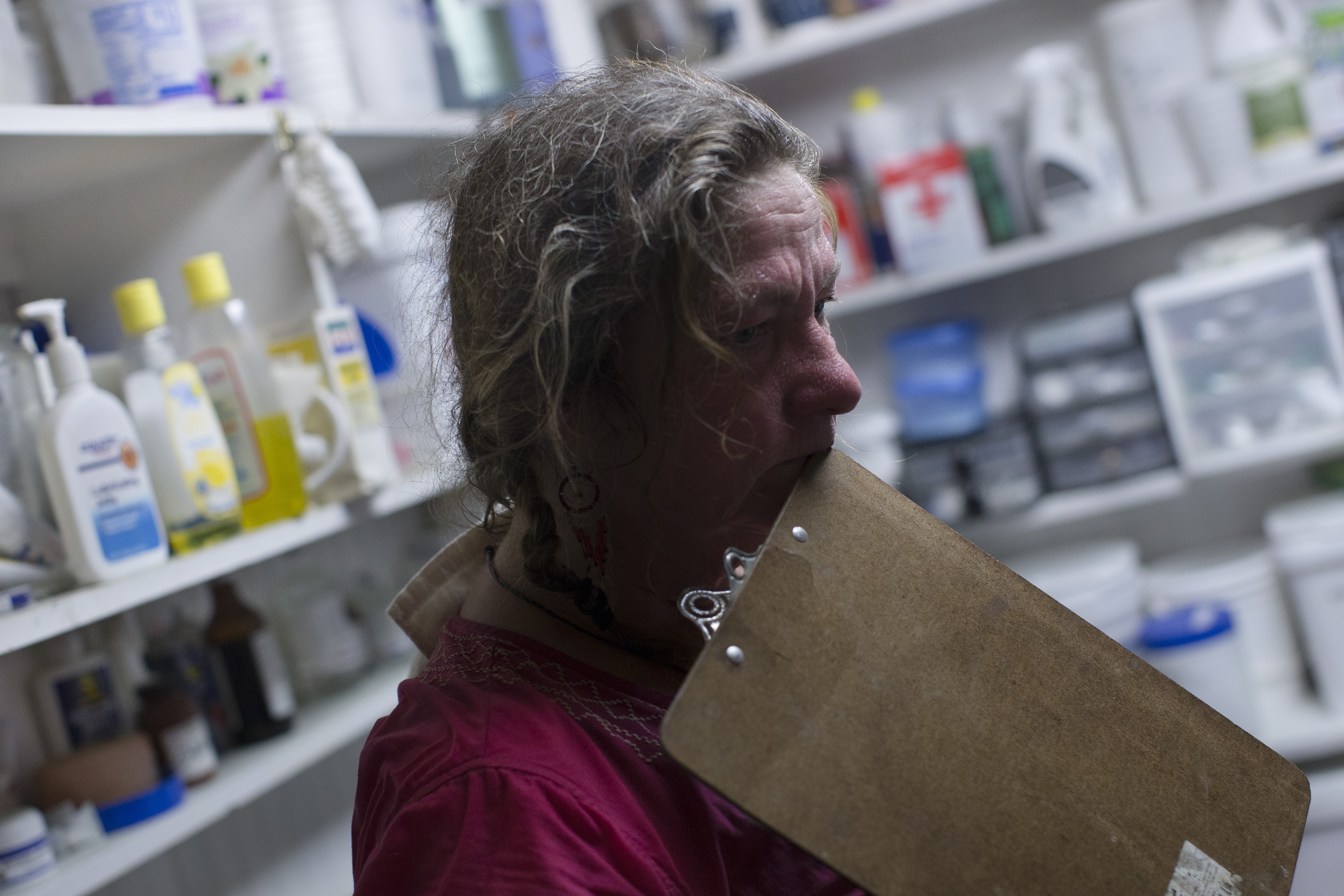 In this Thursday, May 7, 2015 photo, Victoria Goss, founder of Last Chance Corral, stands in the medical supply room as she waits for the result of a colostrum test in Athens, Ohio. Every new foal brought to rescue critical for the development of animal's immune system. In some cases, the foal is separated from the mother before the antibody transfer occurs, requiring intervention at the rescue. (AP Photo/John Minchillo) (AP)
