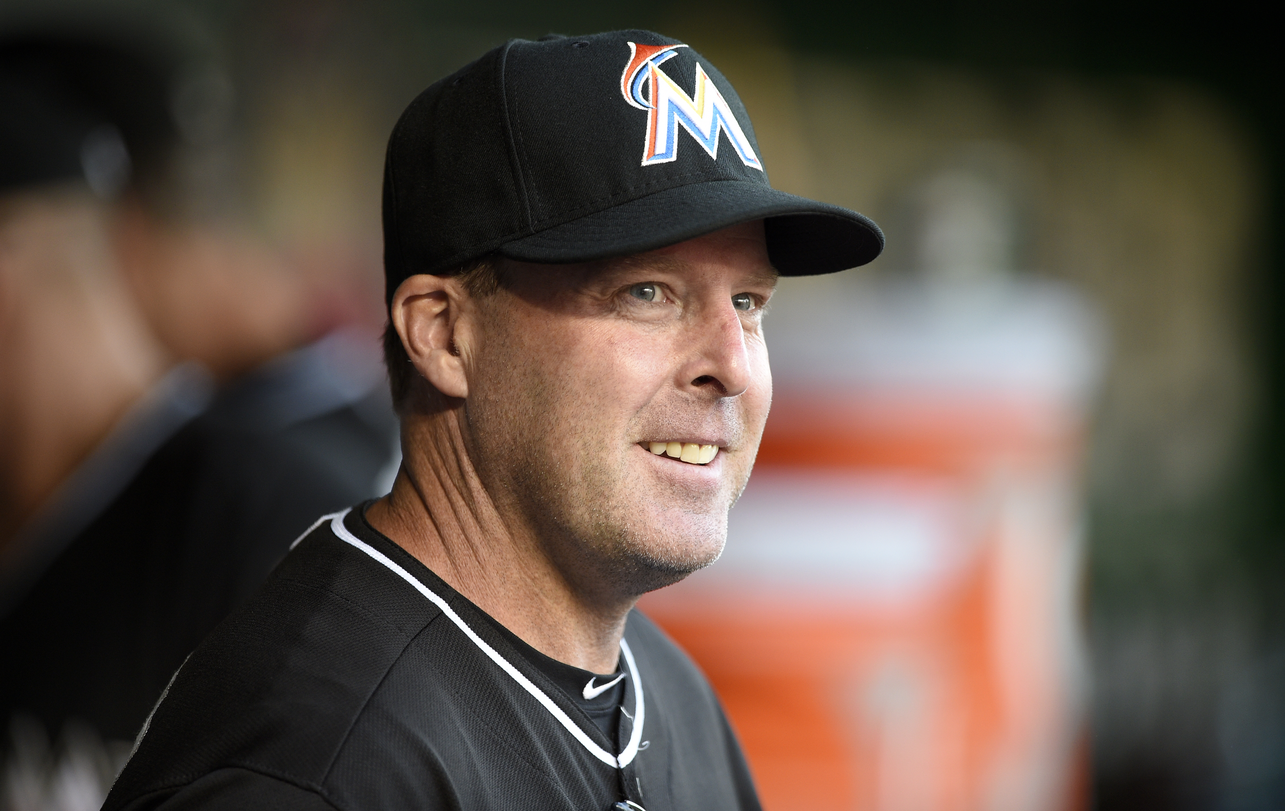FILE- In this May 4, 2015, file photo, Miami Marlins manager Mike Redmond looks on from the dugout before a baseball game against the Washington Nationals in Washington. Redmond was fired Sunday, May 17, after the Marlins were nearly no-hit in a 6-0 loss to Atlanta that completed a three-game sweep. (AP Photo/Nick Wass, File) (AP)