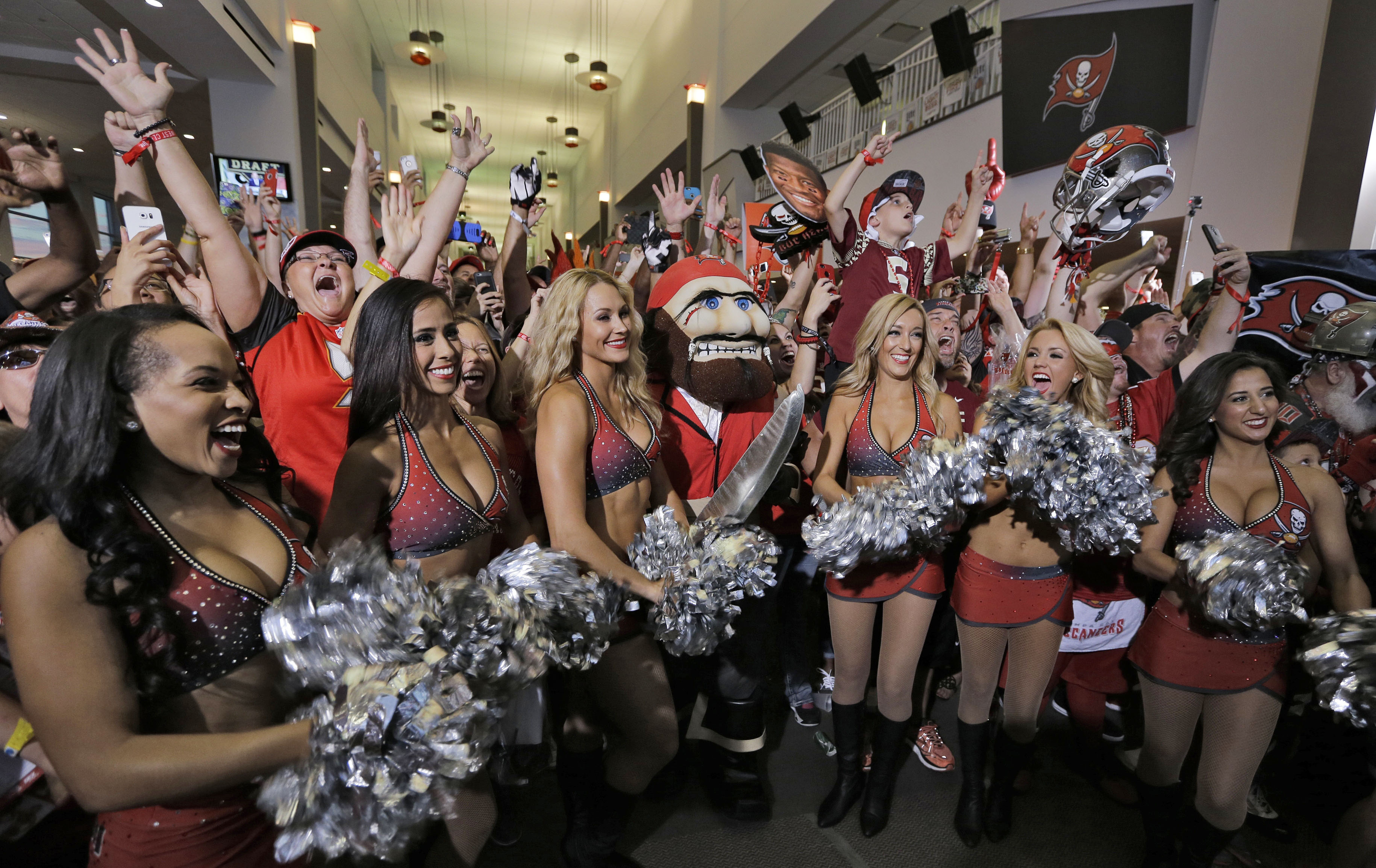 The Tampa Bay Buccaneers cheerleaders celebrate along with fans after the team drafted former Florida State quarterback Jameis Winston during an NFL draft party Thursday, April 30, 2015, in Tampa, Fla. Winston was the first overall pick in the draft. (AP Photo/Chris O'Meara) (AP)