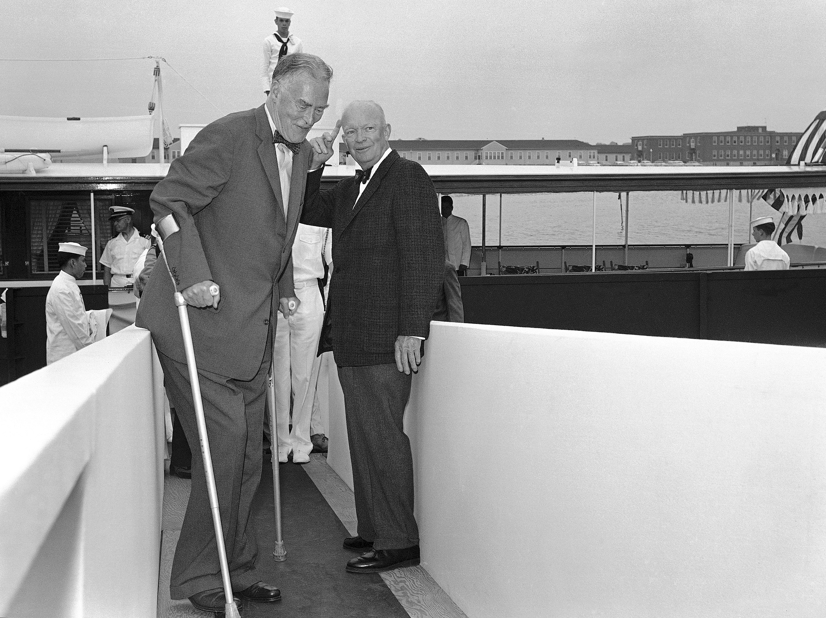 FILE - In this July 10, 1060 file photo, President  Dwight Eisenhower, right, waves good evening to Secretary of State Christian Herter, after accompanying Herter and his party from his summer house at Ft. Adams in Newport, R.I. Once home to the Americas Cup, Newport has a rich sailing history and is making strides to reaffirm its position as an international sailing mecca. It is hosting this 2015's only North American stopover on the Volvo Ocean Race, the worlds most prestigious offshore racing event. (AP Photo/File) (AP)