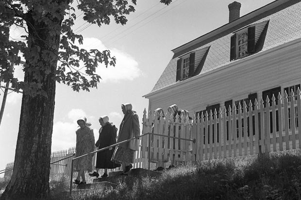 Three Shaker sisters, leaving the old meeting house in Sabbathday Lake, Me., June 7, 1962. (AP)