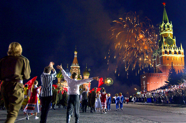 People celebrate as fireworks explode over the Kremlin to mark the 60th anniversary of the Allies' victory over Nazi Germany near the Red Square in Moscow, May 9, 2005. (AP)