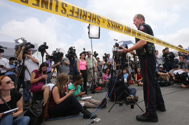 Waco Police Sgt. Patrick Swanton addresses the media as law enforcement continues to investigate the motorcycle gang related shooting at the Twin Peaks restaurant, Monday, May 18, 2015, in Waco, Texas. (AP/Jerry Larson)