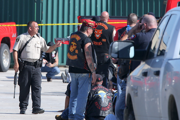 Authorities investigate a shooting in the parking lot of the Twin Peaks restaurant Sunday, May 17, 2015, in Waco, Texas. (AP/Jerry Larson)