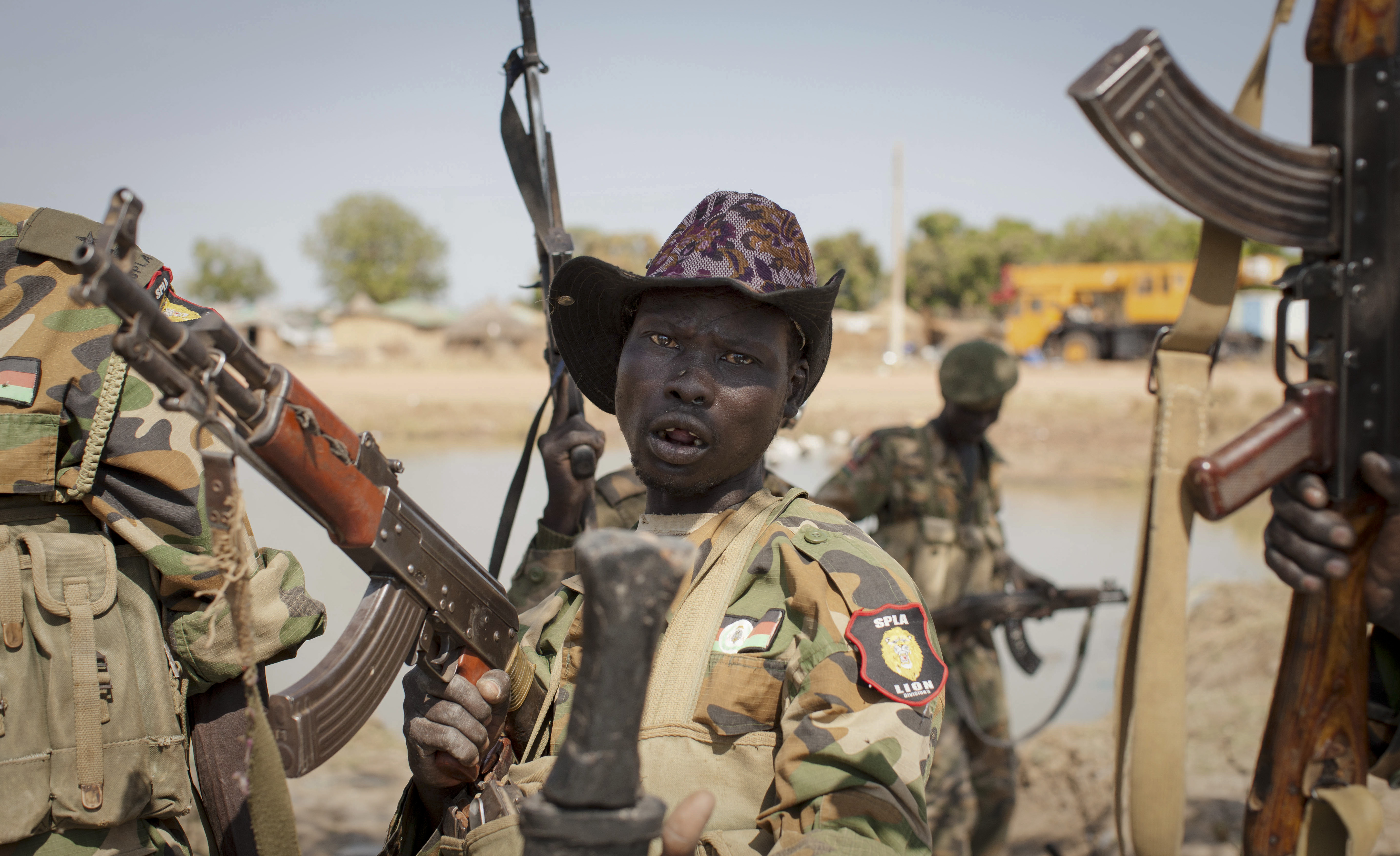 A South Sudanese government soldier chants in celebration (AP/Mackenzie Knowles-Coursin)