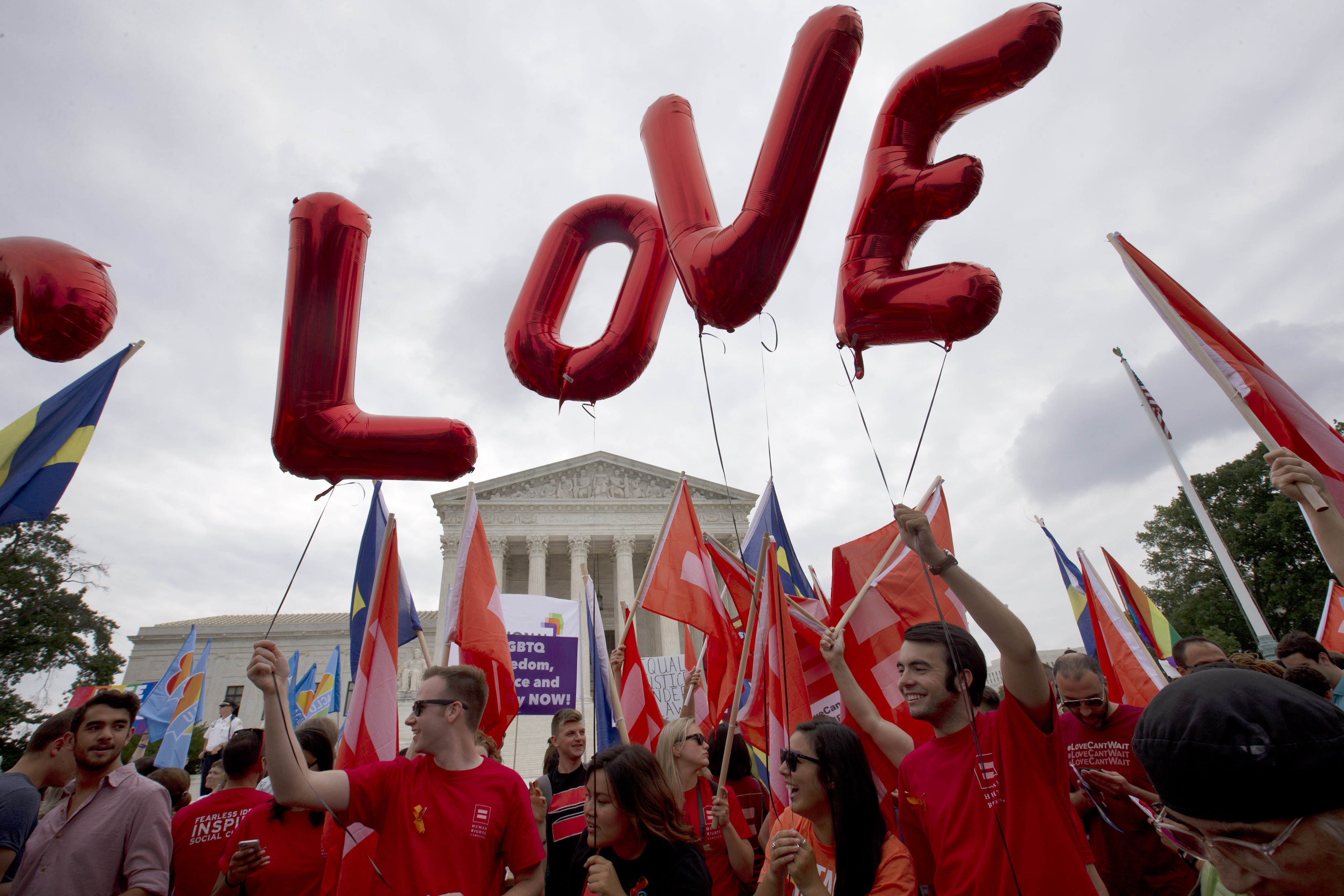 Balloons spell out the word "love" over the Supreme Court in Washington, Friday June 26, 2015, after the court declared that same-sex couples have a right to marry anywhere in the US.  (AP Photo/Jacquelyn Martin) (AP)