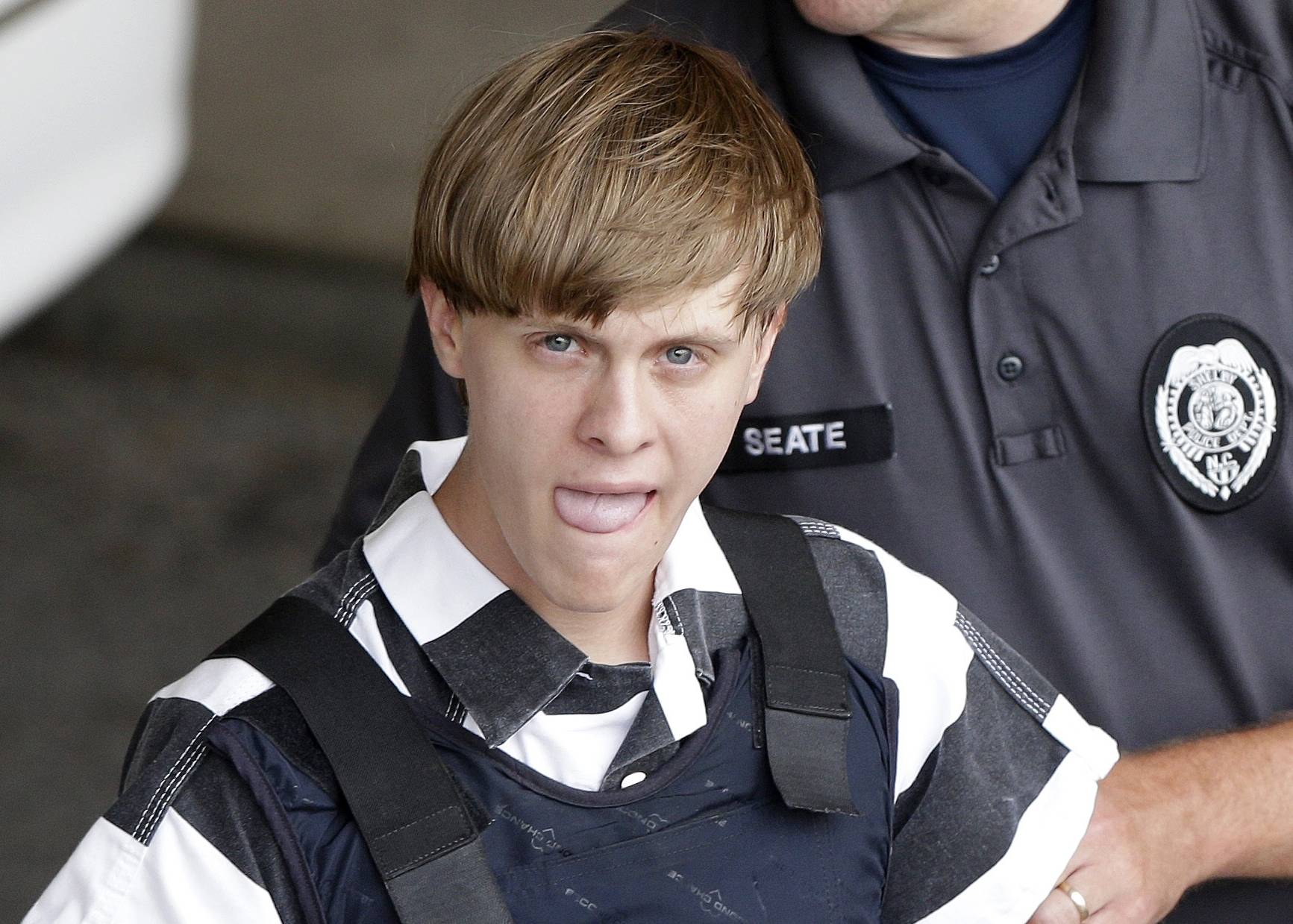 Charleston, S.C., shooting suspect Dylann Storm Roof is escorted from the Cleveland County Courthouse in Shelby, N.C., Thursday, June 18, 2015. (AP/Chuck Burton)