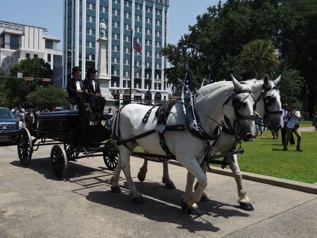 Sen. Clementa Pinckney's body arrives by horse drawn carriage at the South Carolina Statehouse, Wednesday, June 24, 2015, in Columbia, S.C. (AP/Rainier Ehrhardt)