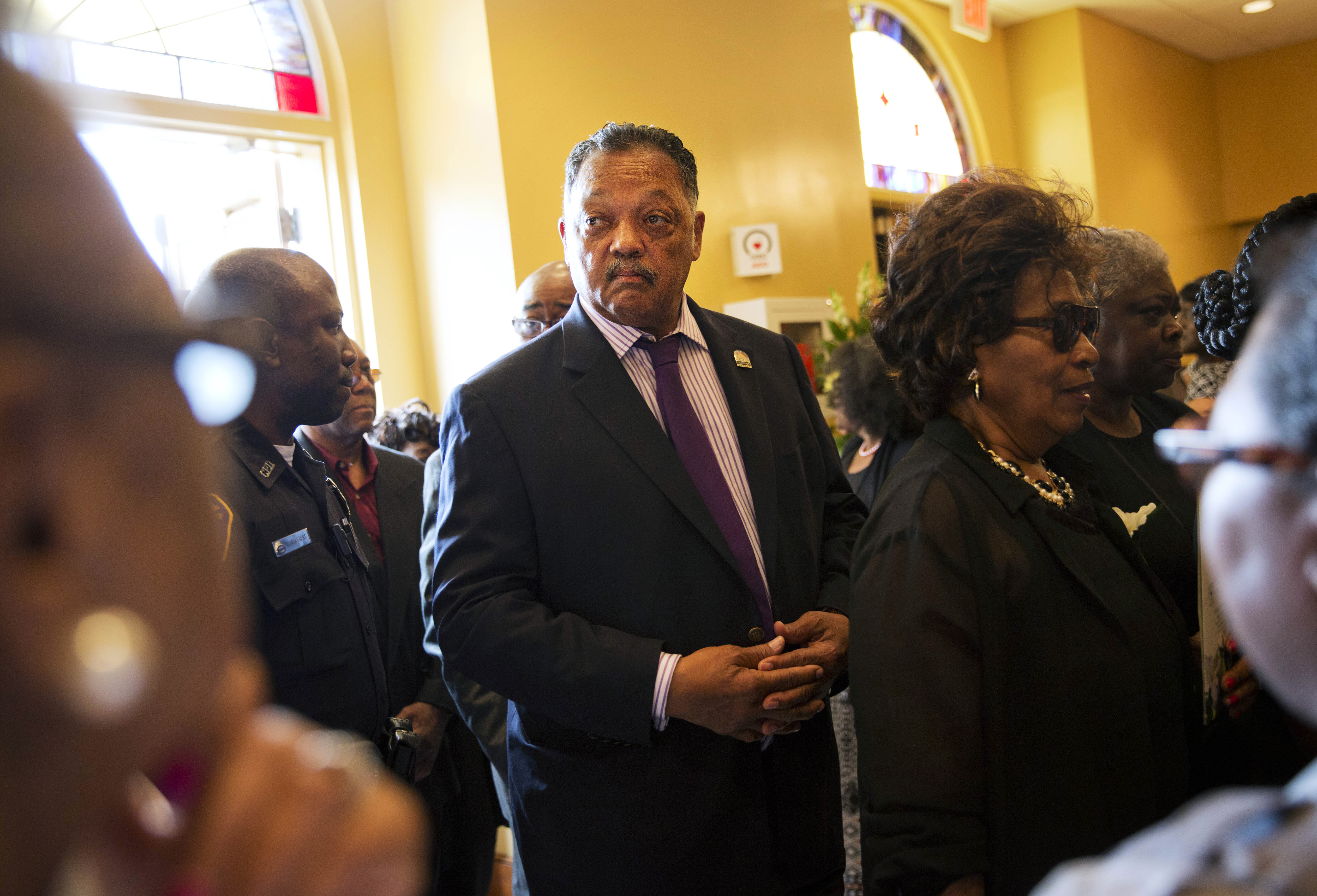The Rev. Jesse Jackson arrives for the funeral service for Ethel Lance, 70, one of the nine people killed in the shooting at Emanuel AME Church. (AP Photo/David Goldman)