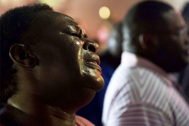Lisa Doctor joins a prayer circle early Thursday, June 18, 2015, down the street from Emanuel AME Church following the shooting Wednesday night in Charleston, S.C. (AP/David Goldman)
