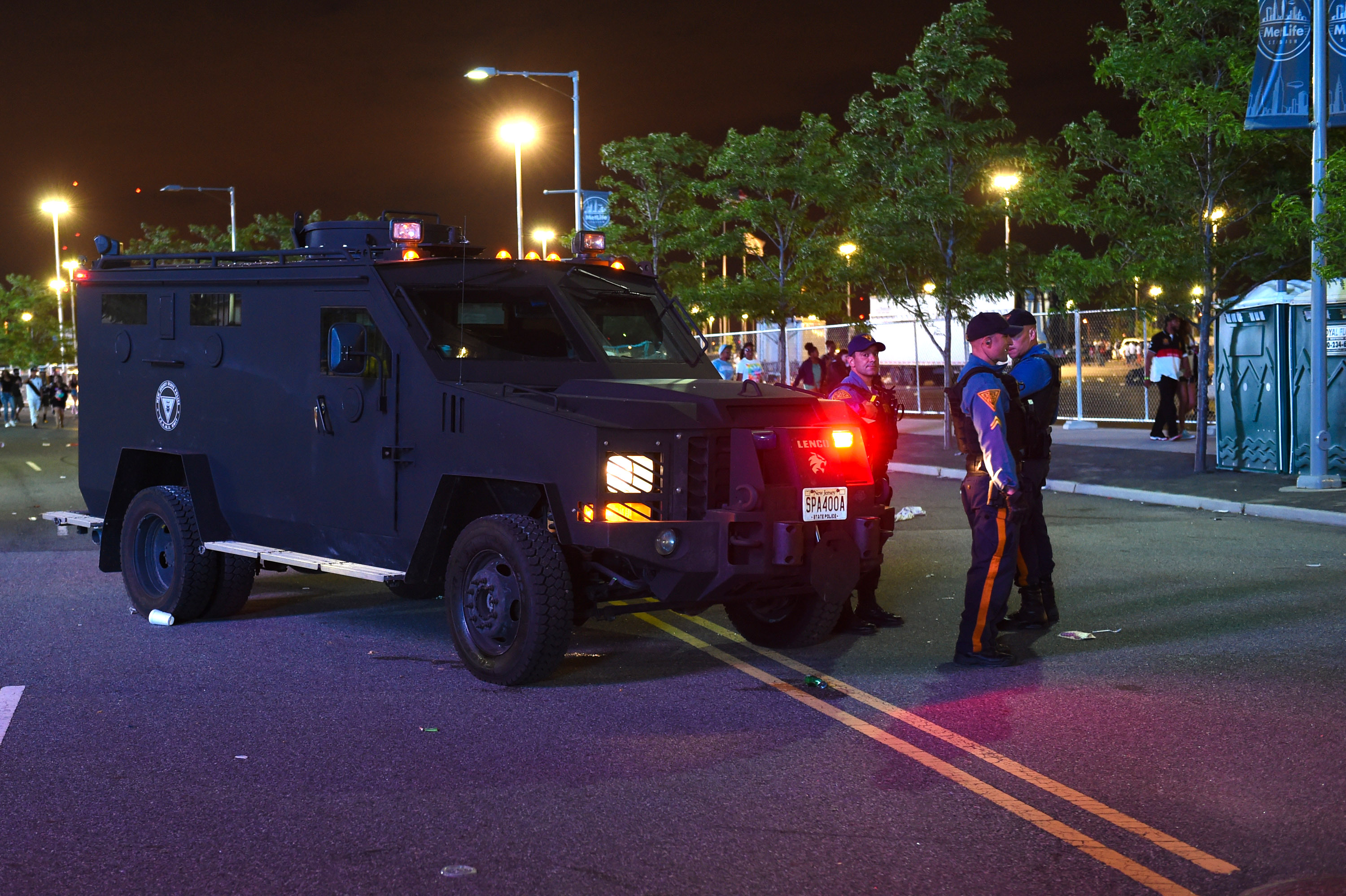 Police stand guard near the entrance of MetLife Stadium during Hot 97's Summer Jam on Sunday, June 7, 2015, in East Rutherford, New Jersey. The Asbury Park Press reports that crowds at the Hot 97 Summer Jam concert Sunday night became upset when the gates were closed and blocked off by police in riot gear.  The newspaper reports that angry fans threw bottles at the troopers and that tear gas was later deployed by police.  (Photo by Scott Roth/Invision/AP) (Scott Roth/invision/ap)
