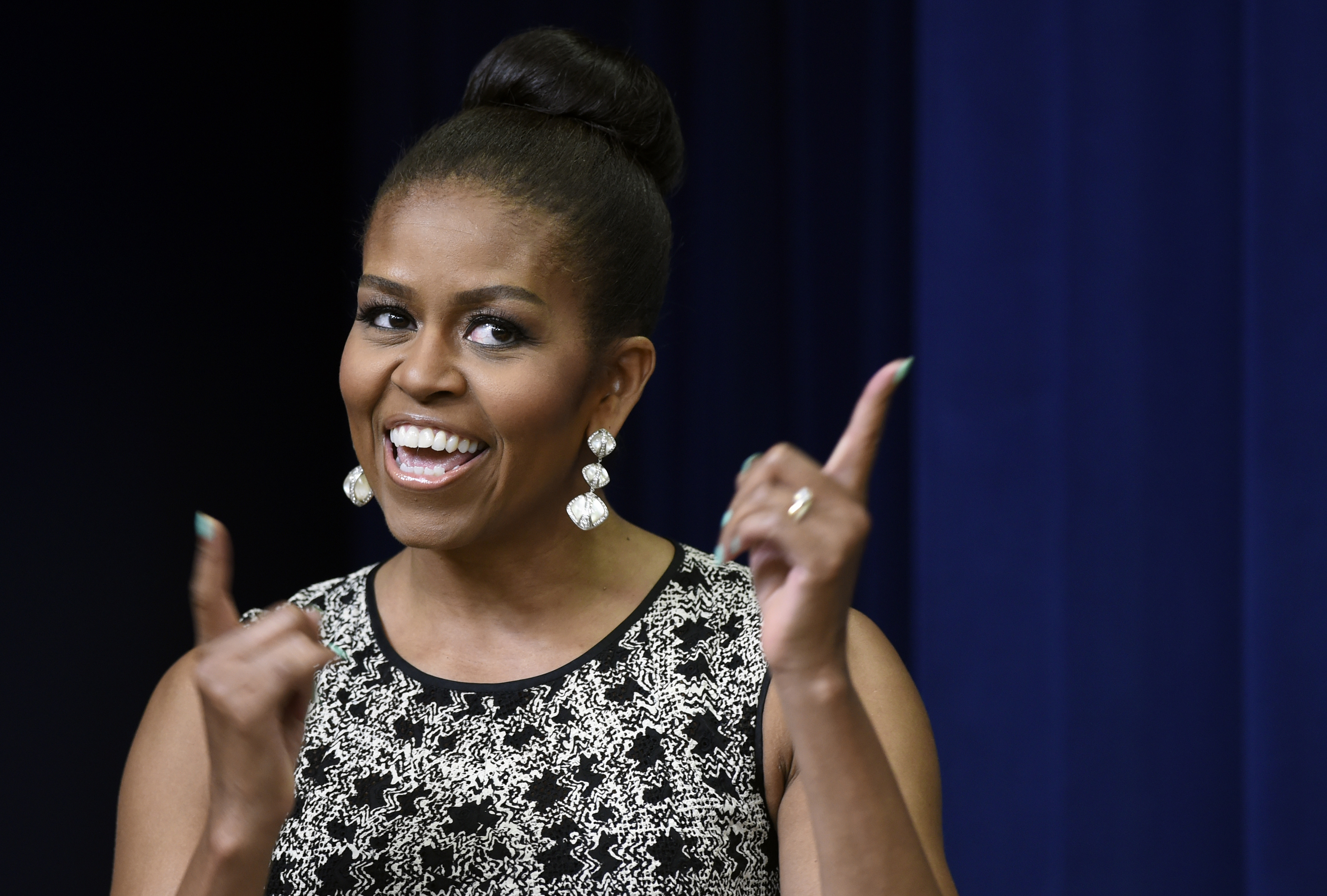 First lady Michelle Obama speaks to a student in the audience at the Celebrating Innovations in Career and Technical Education (CTE) event in the South Court Auditorium in the White House complex in Washington, Tuesday, June 30, 2015. Obama recognized students and educators for their work connecting the classroom to real-life career opportunities. (AP Photo/Susan Walsh) (AP)