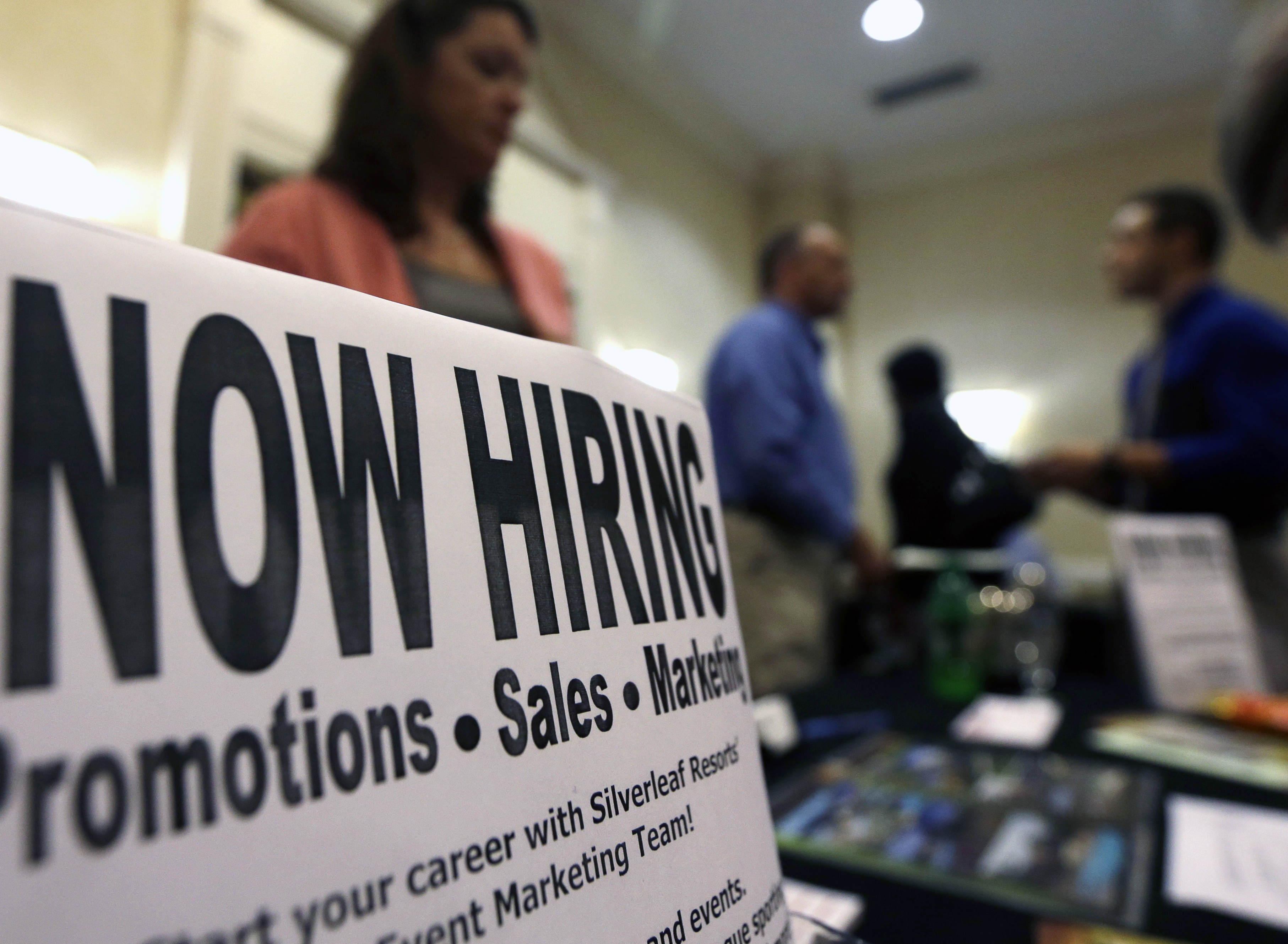 FILE - In this Thursday, Oct. 25, 2012, file photo, a sign attracts job-seekers during a job fair at the Marriott Hotel in Colonie, N.Y. (AP)