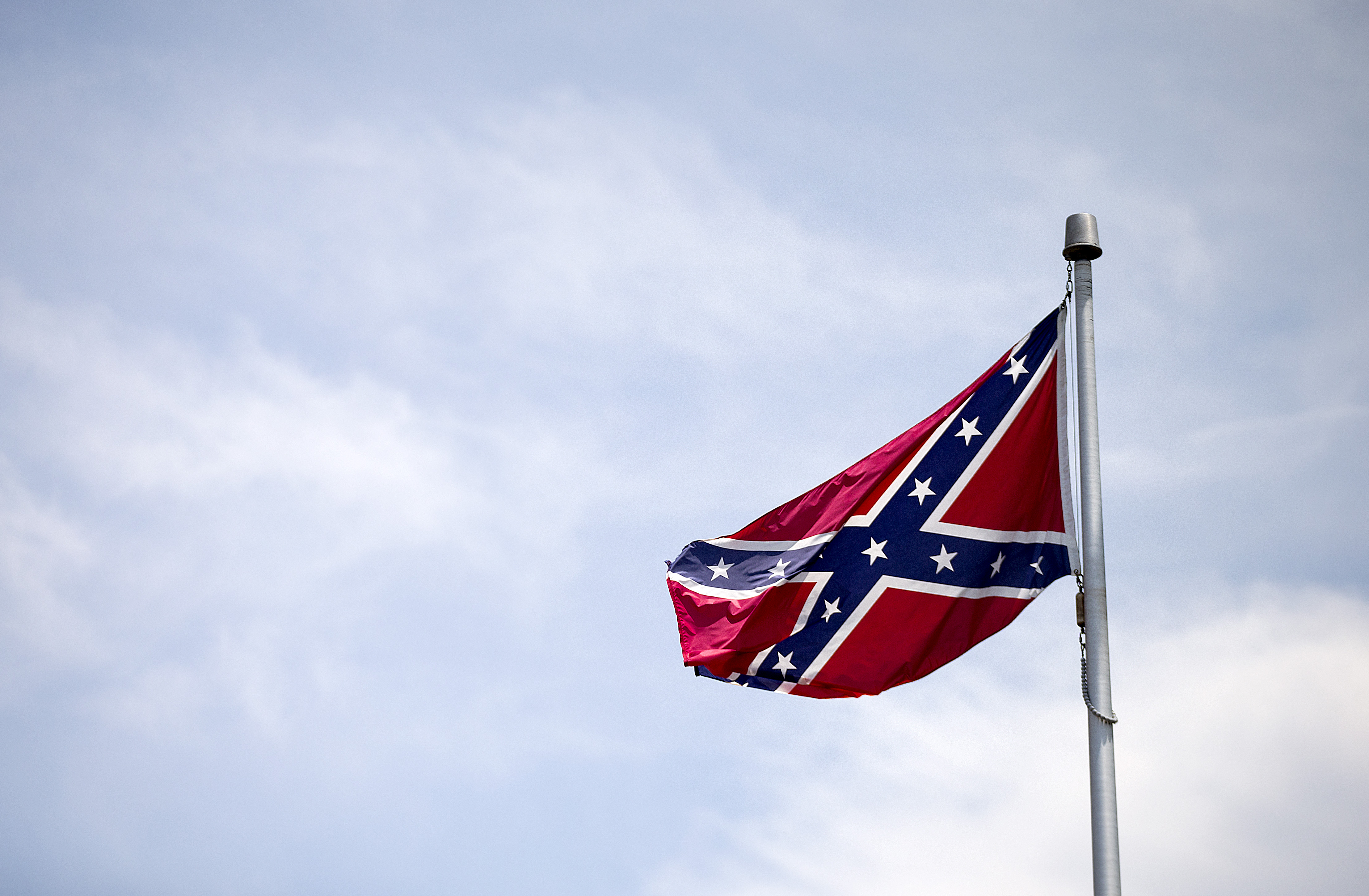 A Confederate flag flies at the base of Stone Mountain Tuesday, June 30, 2015, in Stone Mountain, Ga. (AP Photo/David Goldman) (AP)
