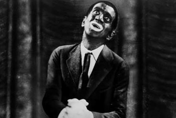 Al Jolson in "The Jazz Singer" (Credit: <a href="https://upload.wikimedia.org/wikipedia/commons/9/9b/Jolson_black.jpg" target="_blank" rel="noopener">Wikimedia Commons</a>)