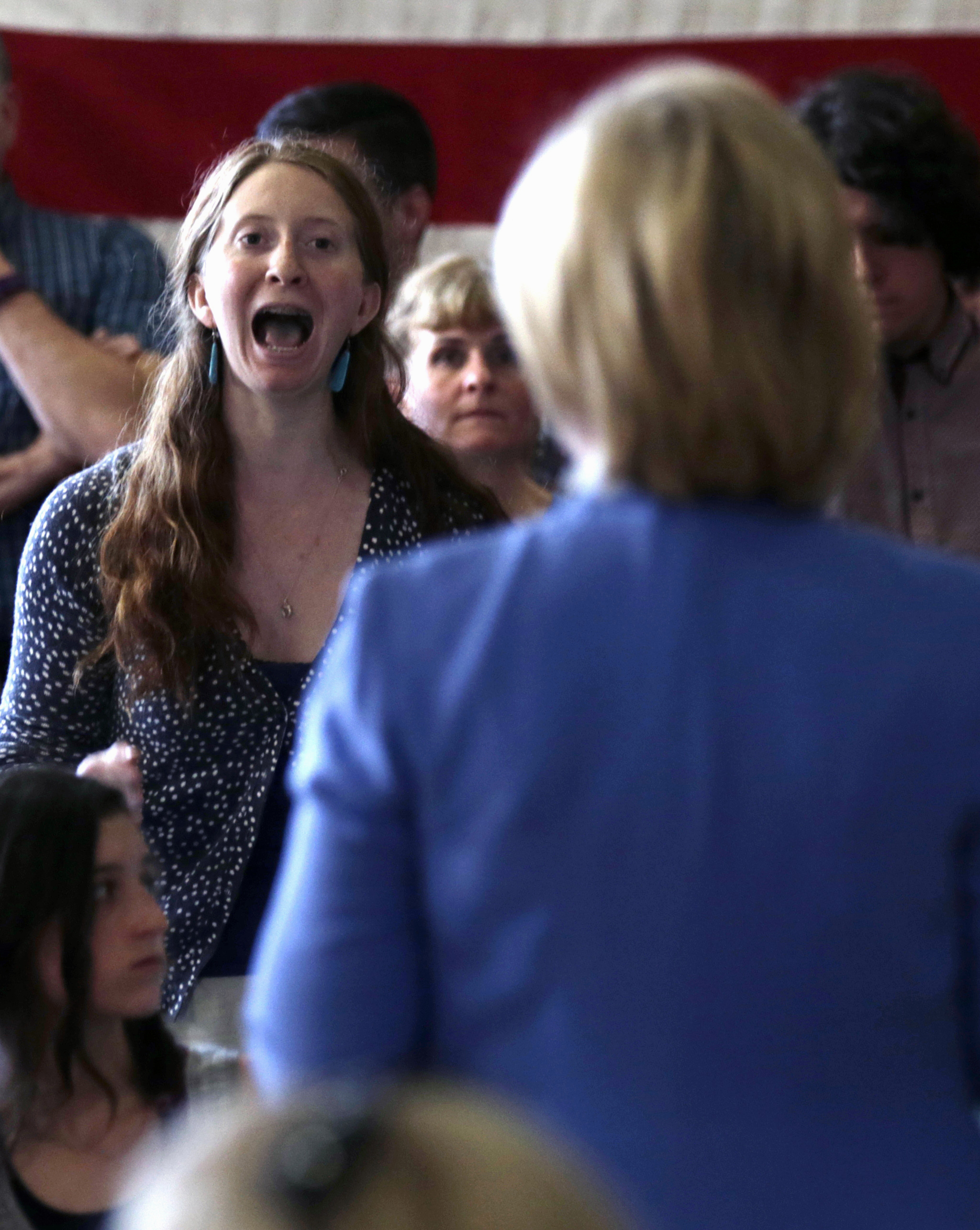 Giselle Hart of Dover, N.H., an environmental activist and student at the University of New Hampshire, interrupts and yells at Democratic presidential candidate Hillary Rodham Clinton, while asking a question during a town hall meeting in Dover, NH, Thursday, July 16, 2015. (AP Photo/Charles Krupa) (AP)