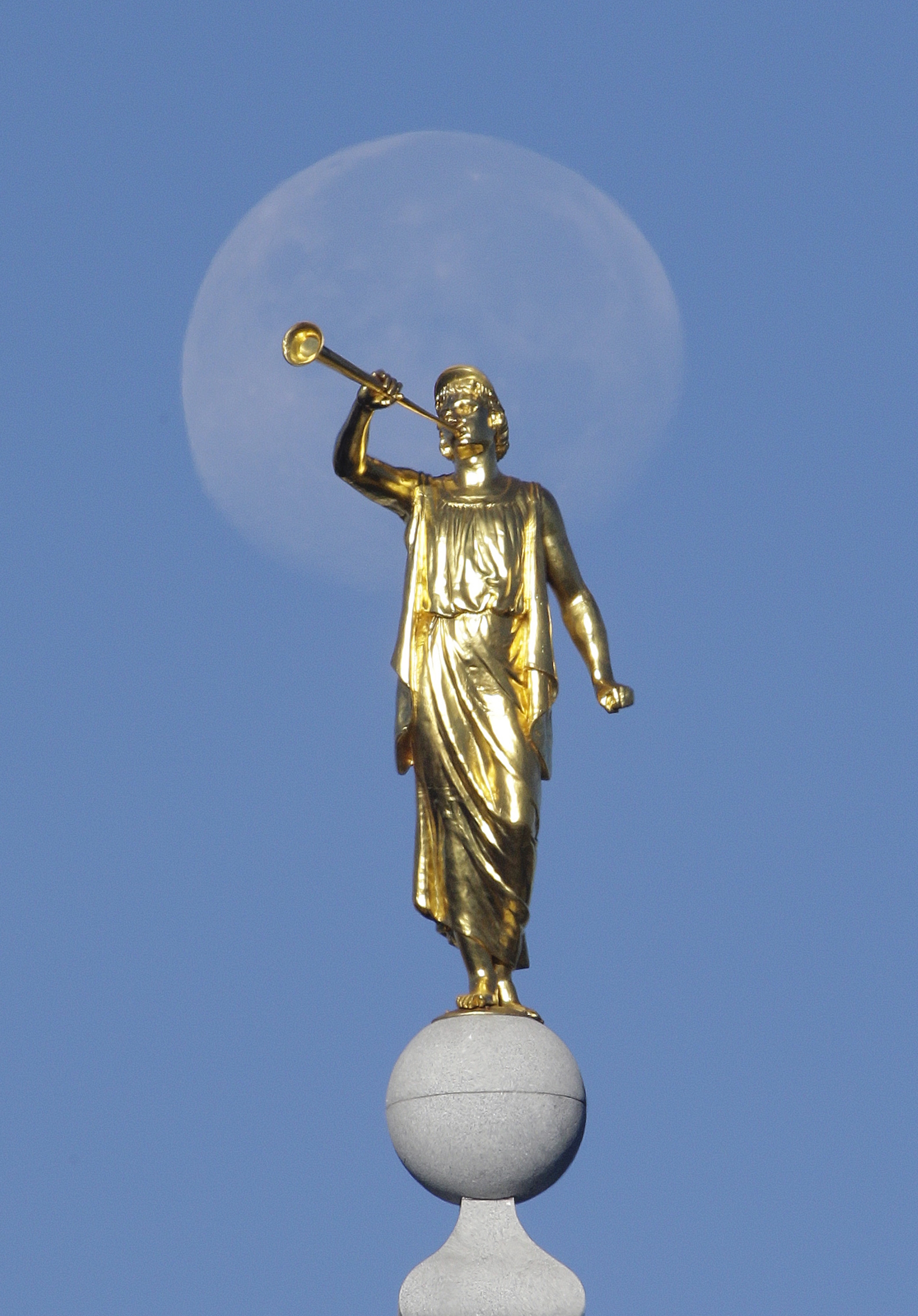 FILE - In this Sept. 11, 2014, file photo, the angel Moroni statue sits atop the Salt Lake Temple, at Temple Square, in Salt Lake City. (AP Photo/Rick Bowmer, File)