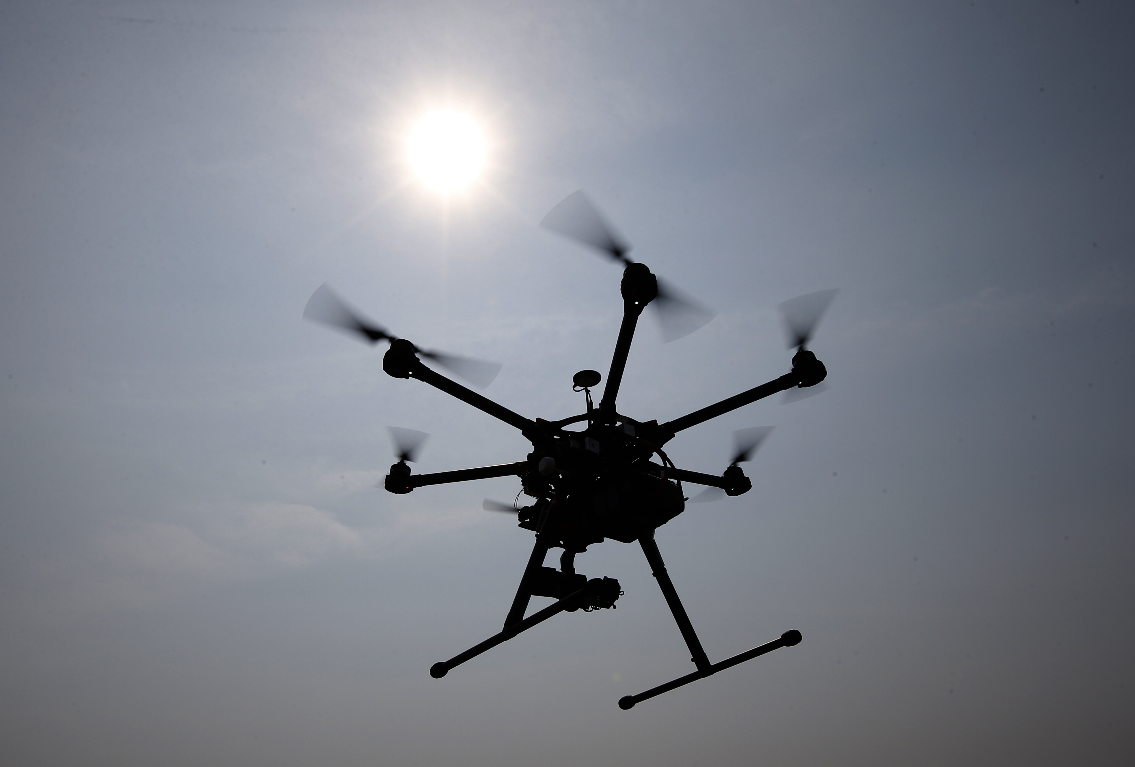 In this June 11, 2015, photo, a hexacopter drone is flown by Doug Bennett, senior technician and operator for Intelligent UAS, during a drone demonstration at a farm and winery on potential use for board members of the National Corn Growers in Cordova, Md. The small, relatively inexpensive unmanned aerial vehicles could replace humans in a variety of ways around large farms, transmitting detailed information about crops, directing farmers to problem spots and cutting down on the amount of water and chemicals used. (AP Photo/Alex Brandon)