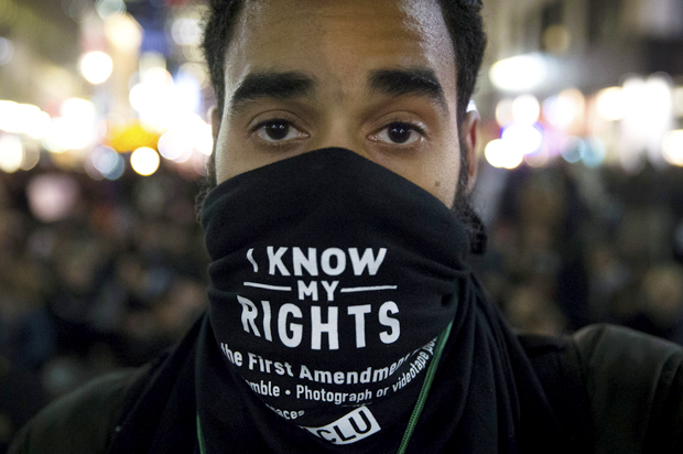 A protestor in New York City, Dec. 4, 2014, against a grand jury's decision not to indict the police officer involved in the death of Eric Garner. (AP/John Minchillo)