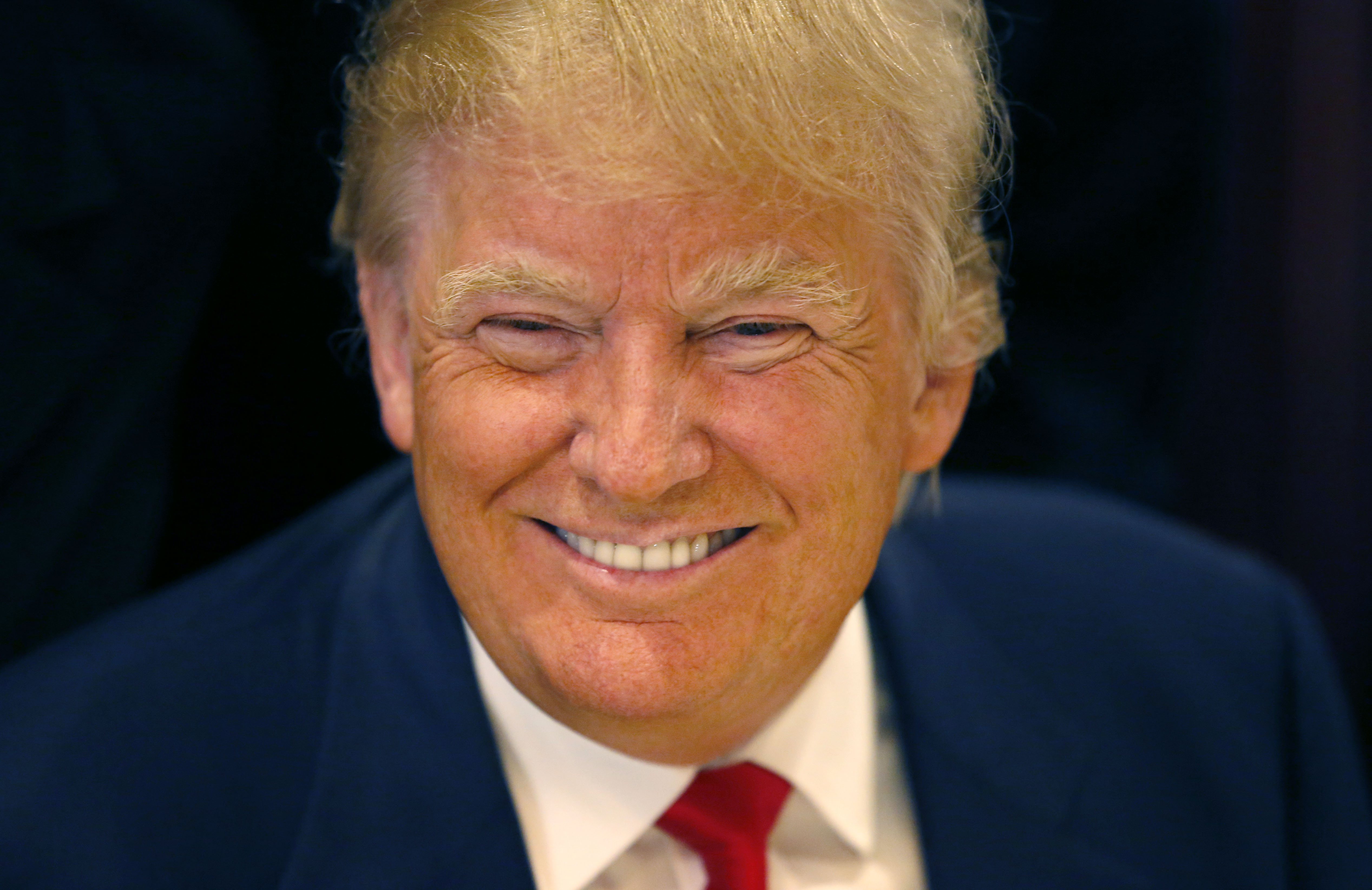 FILE - In this June 29, 2015, file photo, Republican presidential candidate Donald Trump smiles for a photographer before he addresses members of the City Club of Chicago, in Chicago. As other presidential candidates fight to raise money, Trump is reminding everyone hes already got a lot of it. The celebrity businessmans campaign was expected to reveal details on July 15 of his fortune, which he estimated last month at nearly $9 million when announcing his Republican presidential candidacy. (AP Photo/Charles Rex Arbogast, File) (AP)