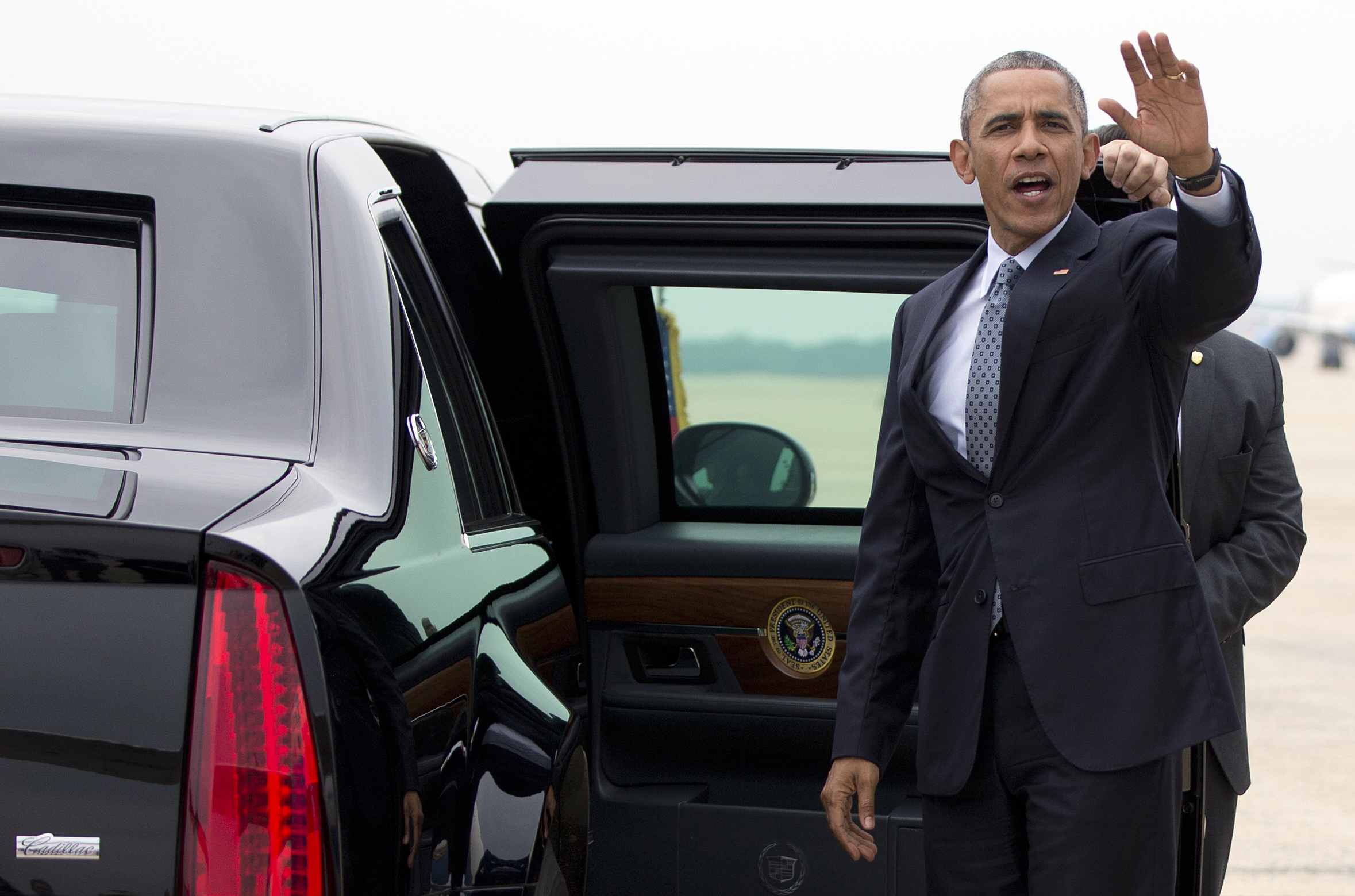President Barack Obama waves before stepping into his motorcade vehicle as he arrives on Air Force One, Thursday, July 2, 2015, at Andrews Air Force Base, Md., en route to Washington as he returns from the University of Wisconsin at La Crosse in La Crosse, Wisc., where he spoke about economy and promoted a proposed Labor Department rule that would make more workers eligible for overtime. (AP Photo/Carolyn Kaster) (AP)