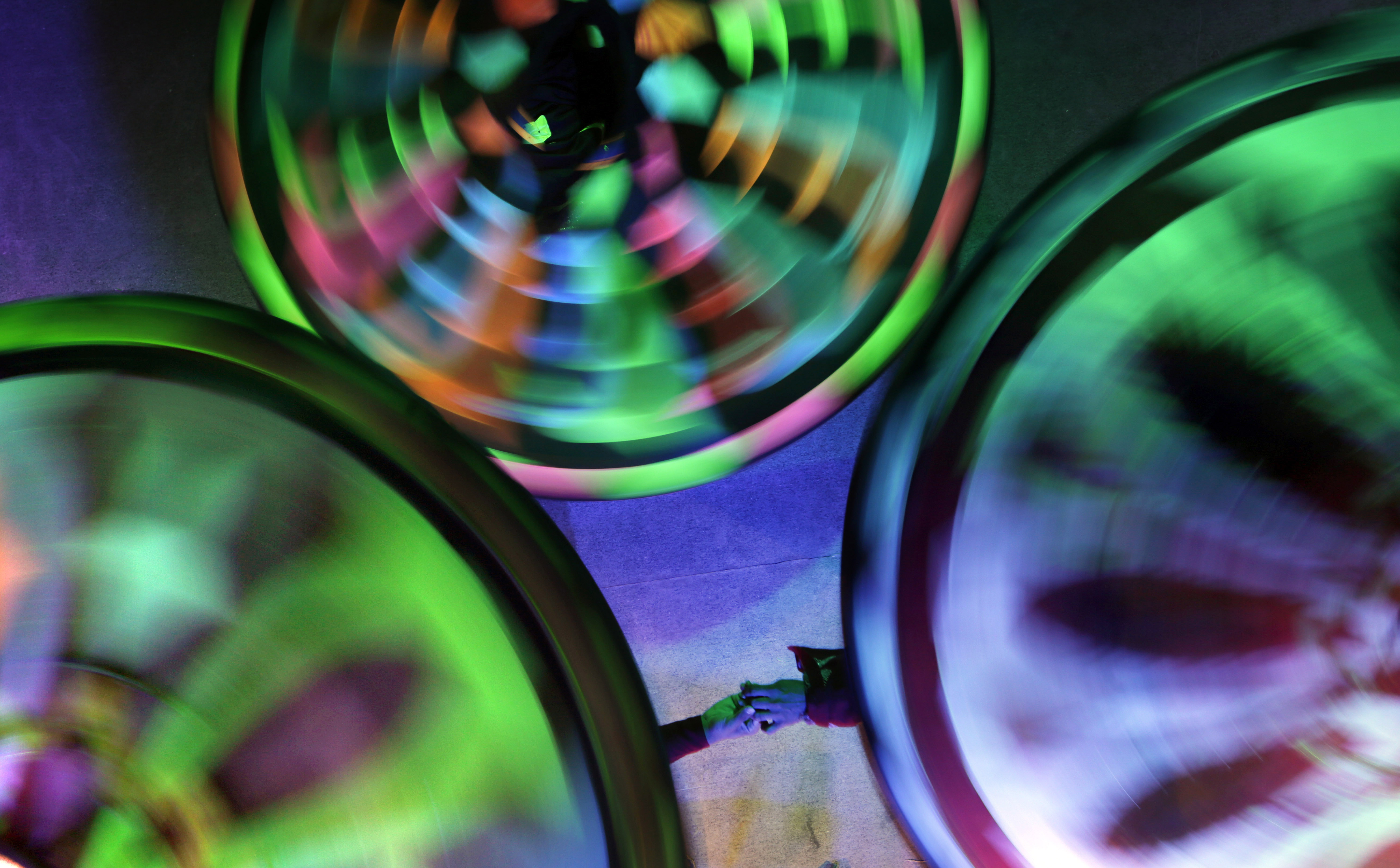 In this Thursday, April 23, 2015 photo, whirling dervishes from the Al-Tannoura Egyptian Heritage Dance Troupe during a performance at the El Sawy cultural center in Cairo, Egypt. The spinning of the dervishes is partially meant to symbolize the way Muslim pilgrims performing the Hajj pilgrimage ritually circle the cube-shaped Kabaa in Mecca, Saudi Arabia. (AP Photo/Amr Nabil) (AP)