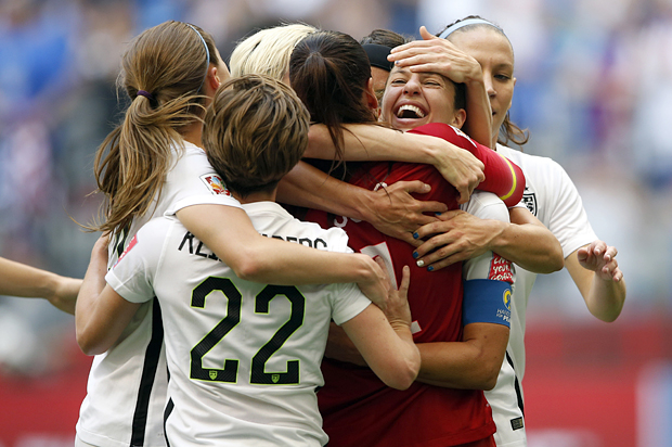 Carli Lloyd celebrates with teammates after scoring against Japan in the final of the FIFA 2015 Women's World Cup, Jul 5, 2015. (Reuters/Michael Chow/USA Today)