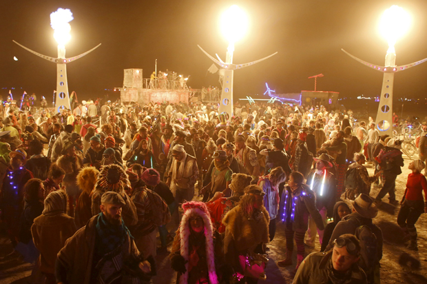 Participants dance at White Ocean during the Burning Man 2015 "Carnival of Mirrors" arts and music festival in the Black Rock Desert of Nevada, September 4, 2015. (Reuters/Jim Urquhart)