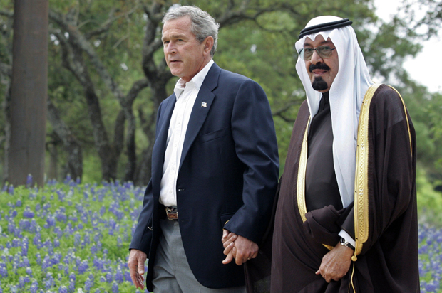 Former President Bush holding hands with the late Saudi King Abdullah, during a visit to Bush's Texas ranch in 2005. (Reuters/Jason Reed)